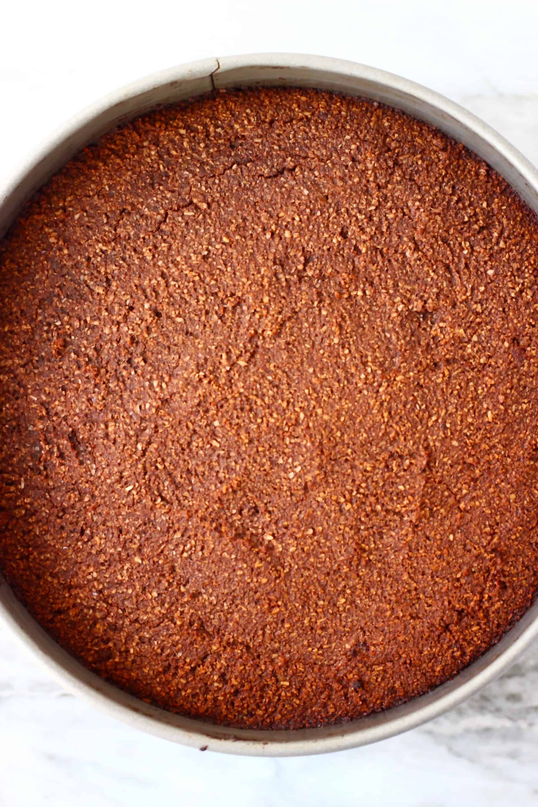 Gluten-free vegan chocolate torte in a springform baking tin 
