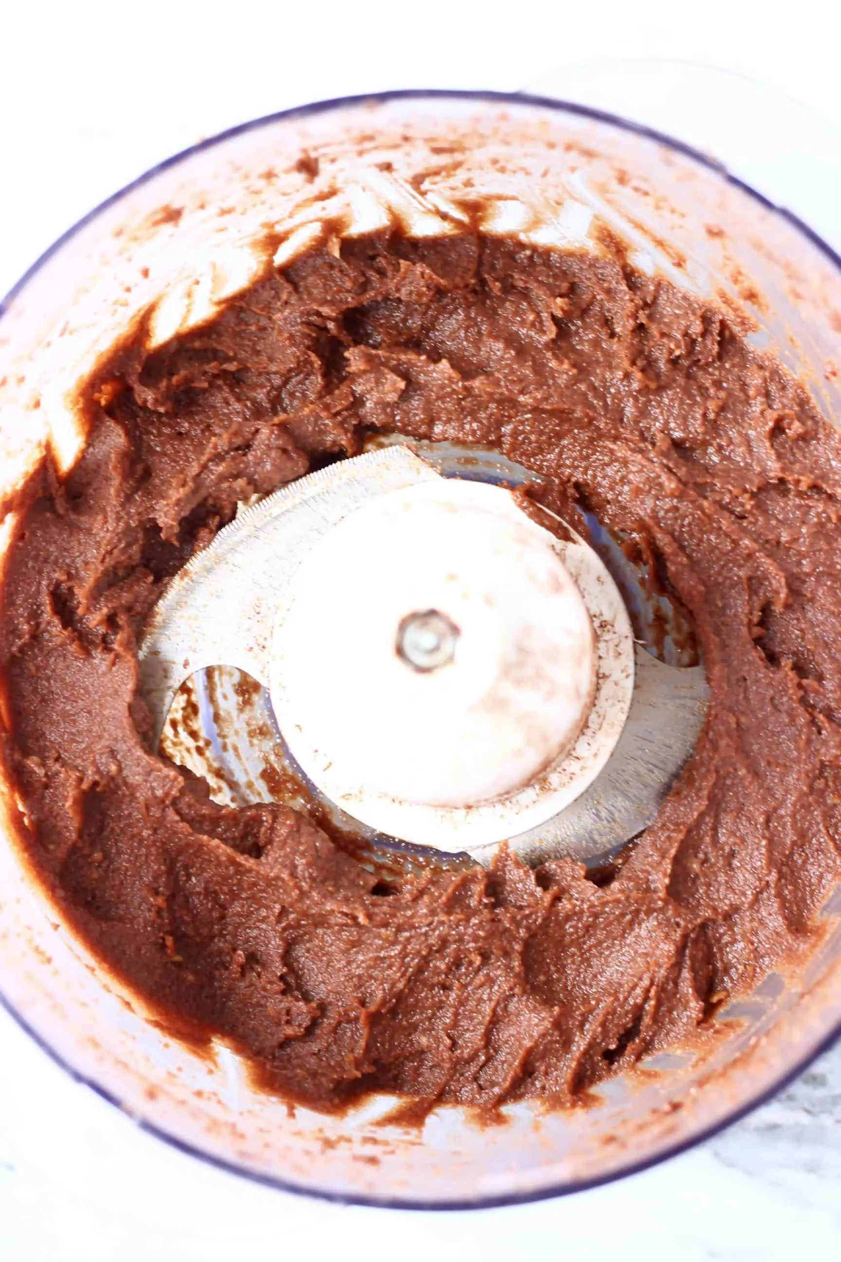Vegan chocolate truffle mixture in a food processor 