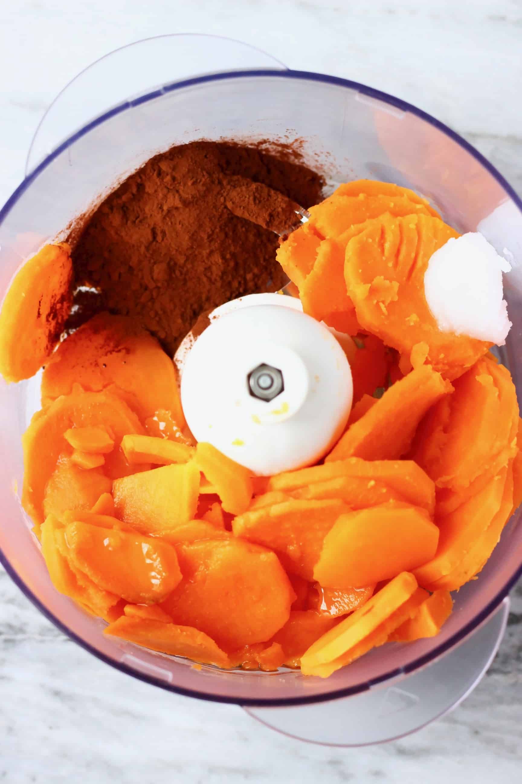 Cooked sweet potatoes, coconut oil and cocoa powder in a food processor 