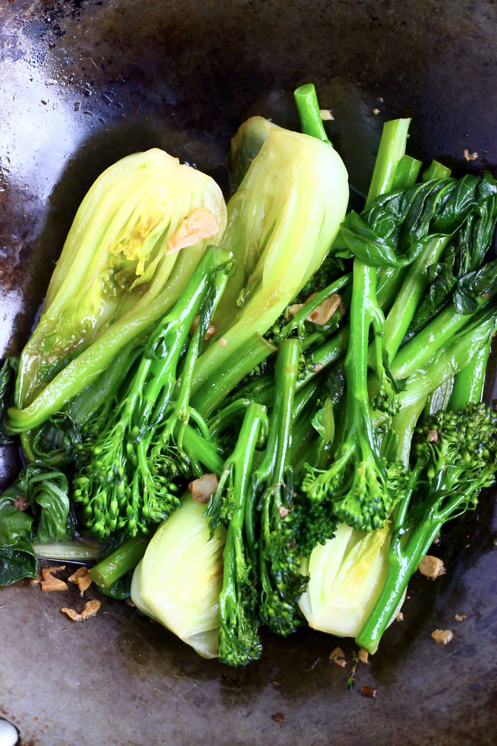 Cooked Wagamama wok-fried greens in a black wok