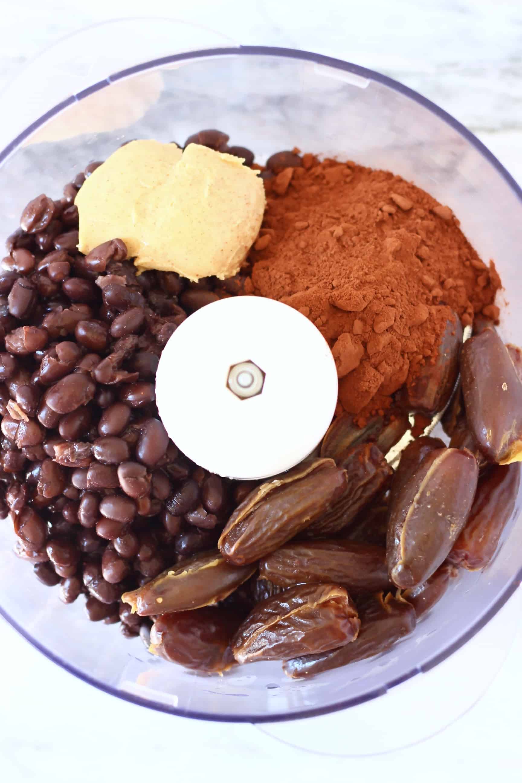 Back beans, cocoa powder, dates and almond butter in a food processor 