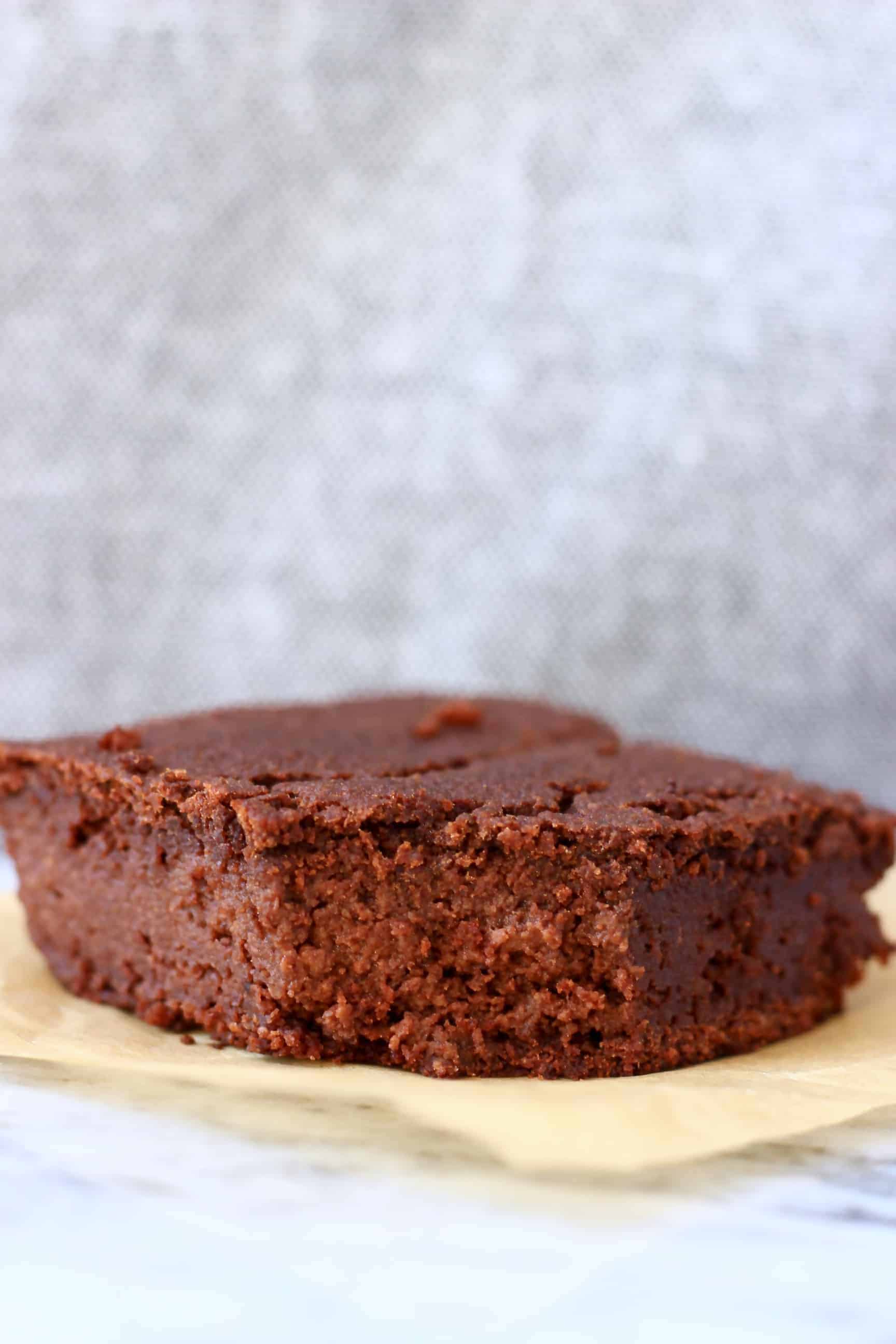 A vegan black bean brownie square with a bite taken out of it