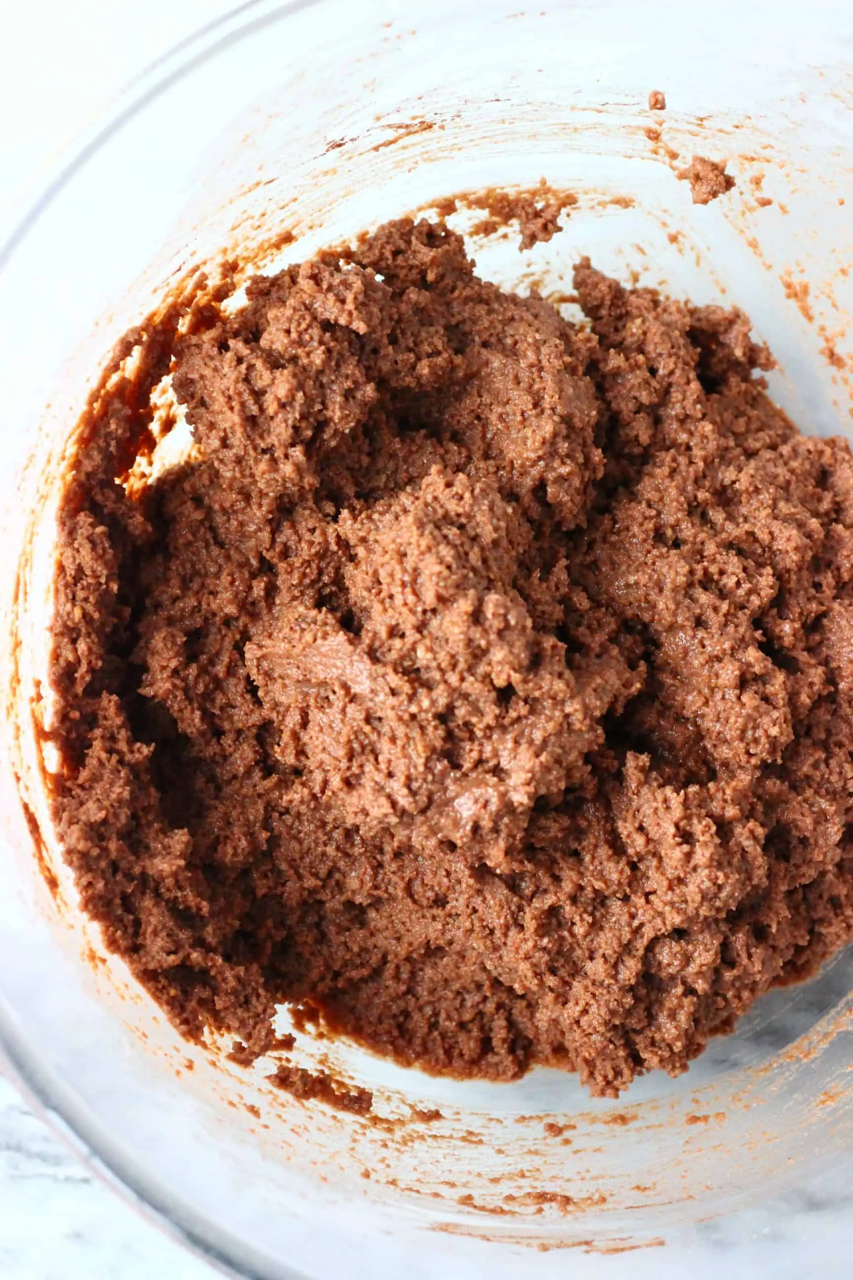 Gluten-free vegan chocolate cake batter in a mixing bowl
