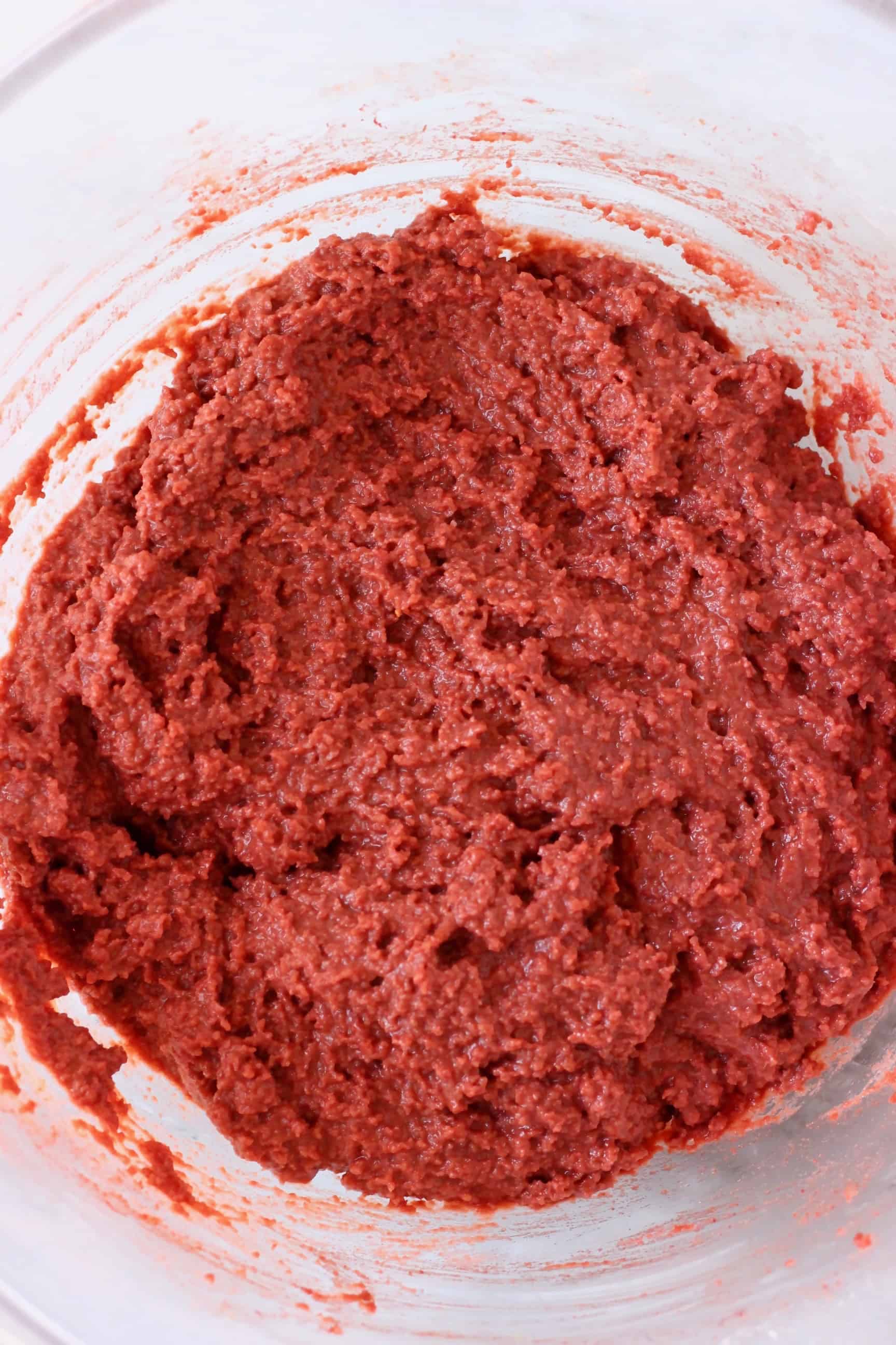 Raw gluten-free vegan red velvet cake batter in a mixing bowl