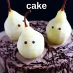 Photo of a chocolate cake topped with three pears made to look like ghosts
