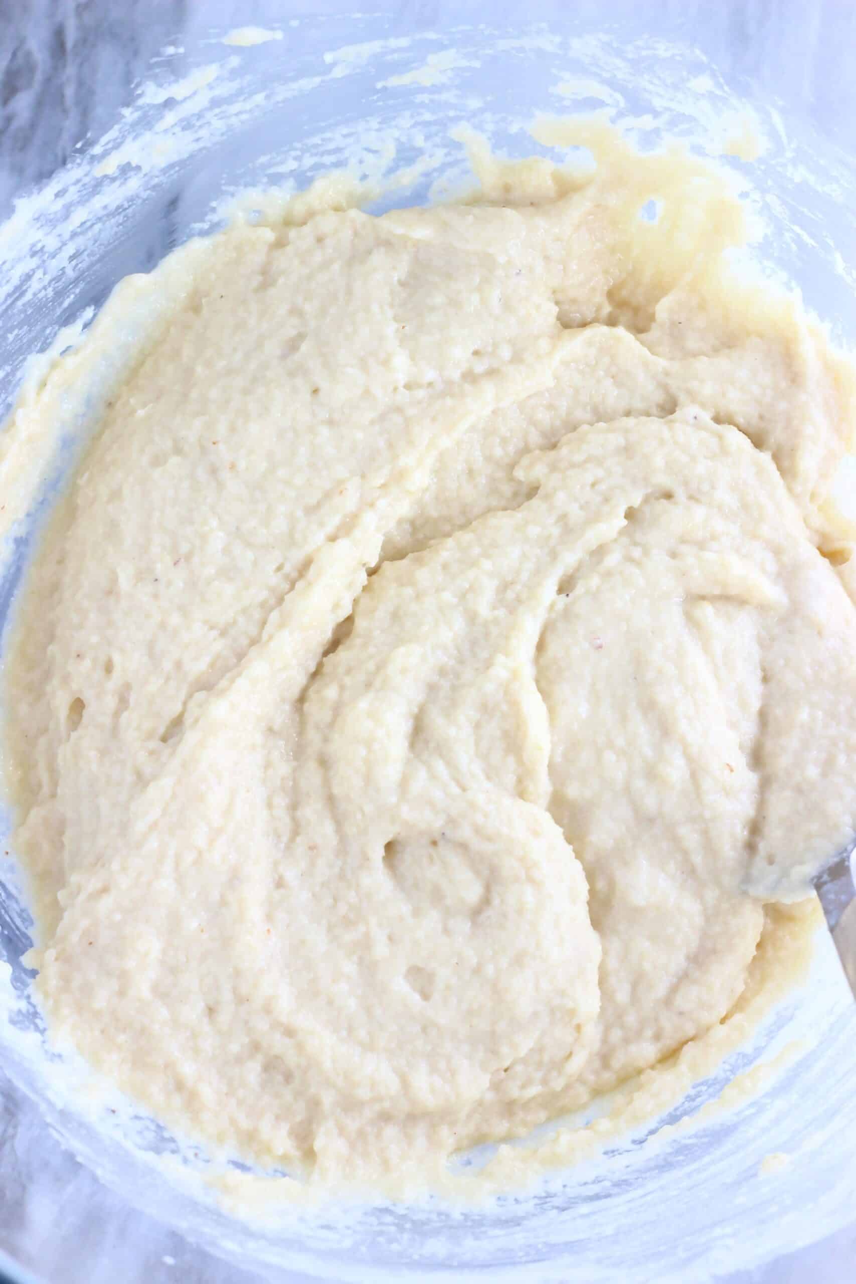 Raw gluten-free vegan pineapple upside down cake batter in a mixing bowl