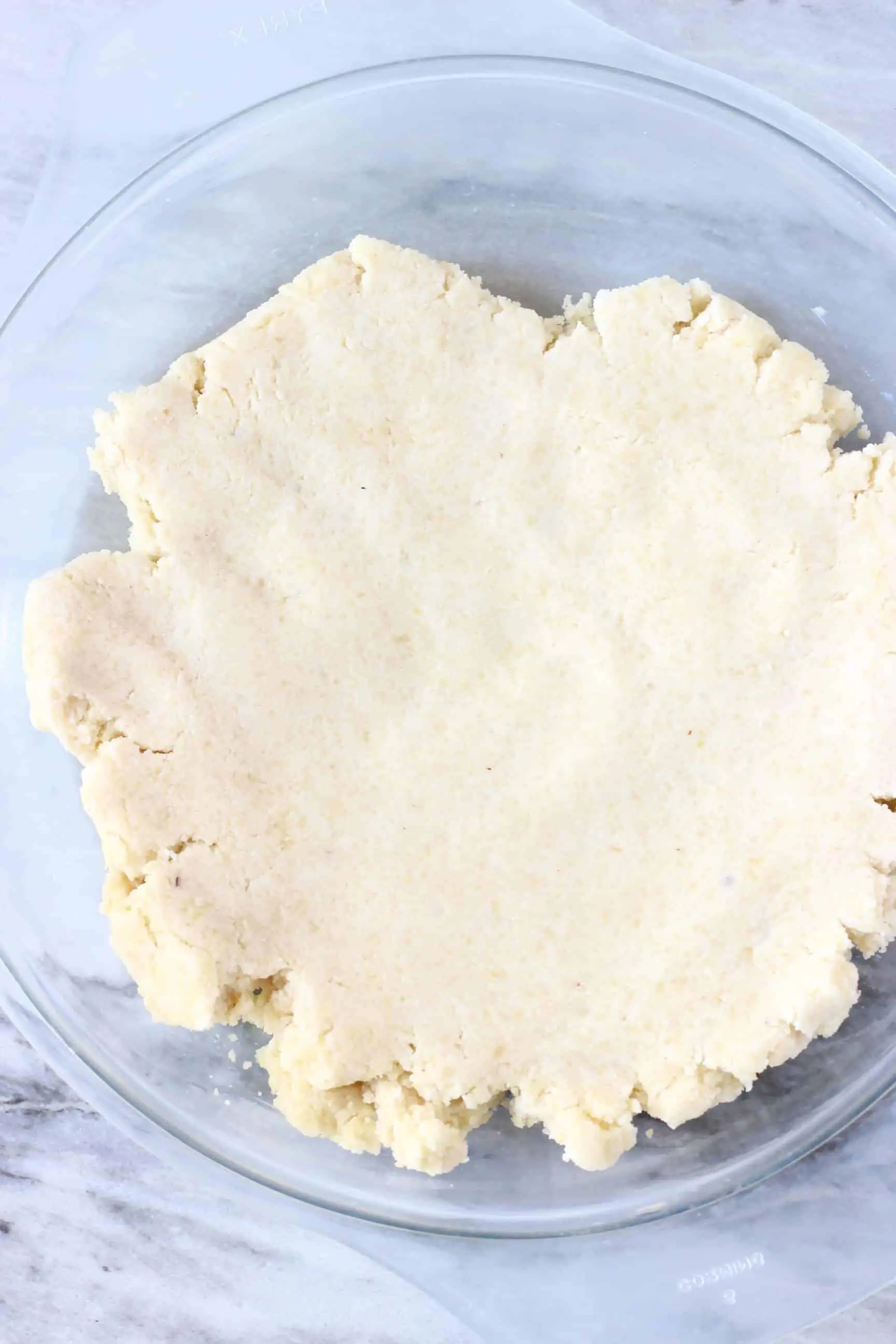 Raw gluten-free vegan pastry dough in a pie dish