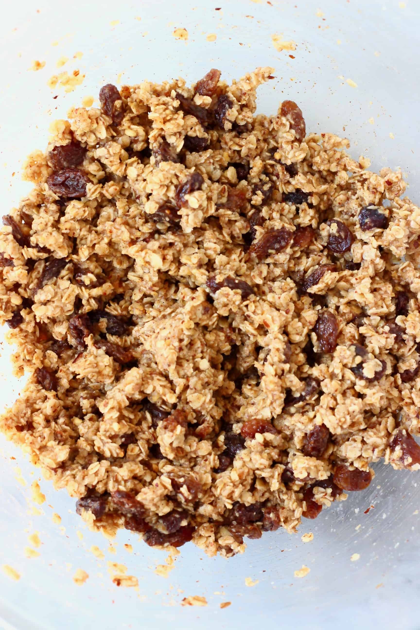 Gluten-free vegan oatmeal raisin cookie dough in a mixing bowl