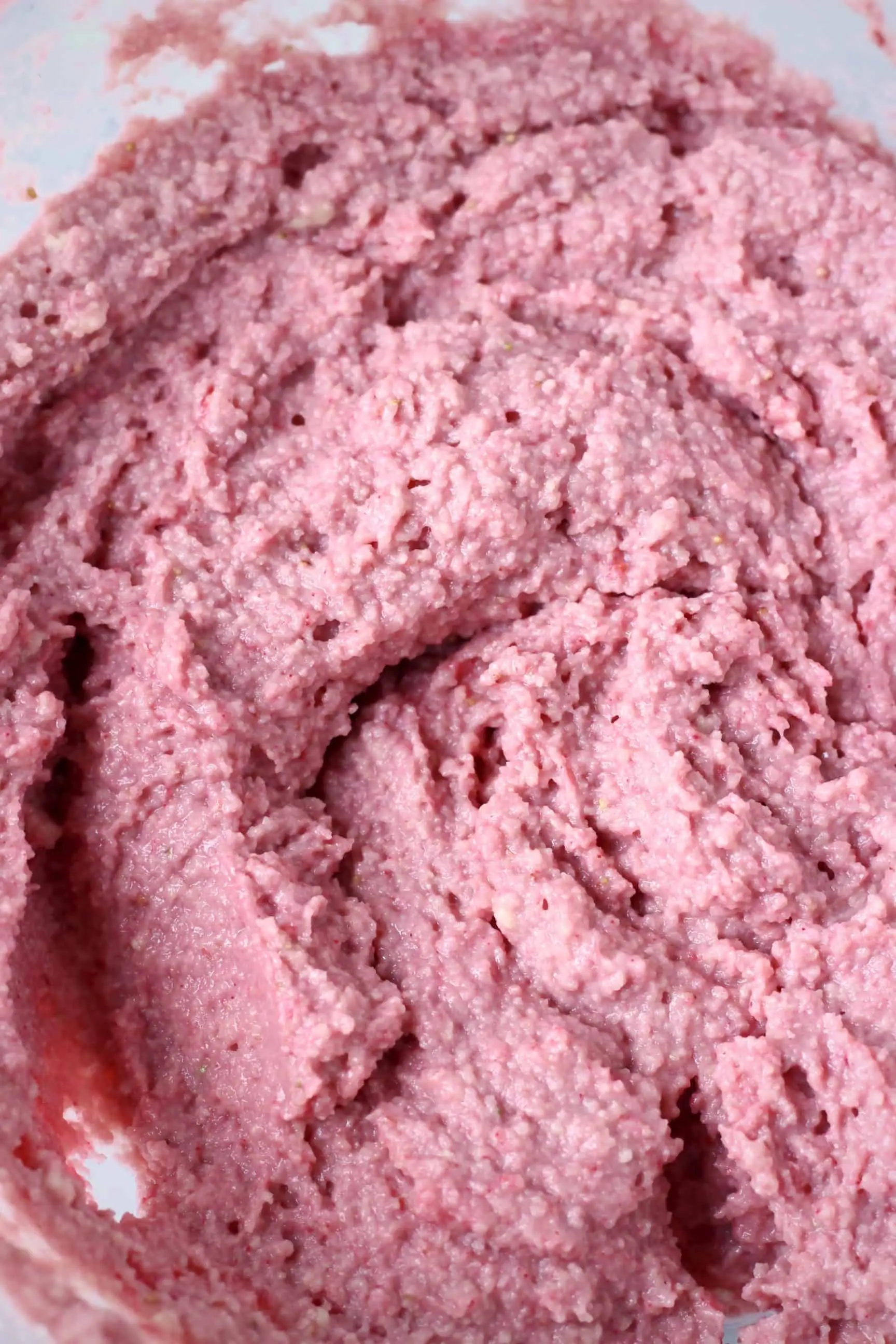 Raw pink gluten-free vegan strawberry cake batter in a bowl