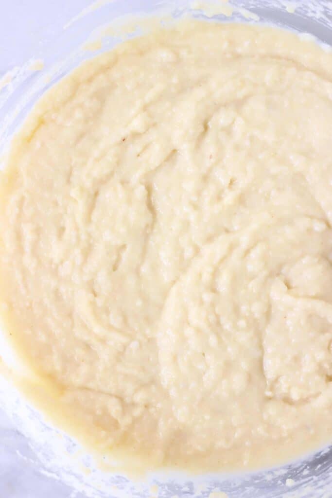Photo of yellow bread batter in a glass mixing bowl