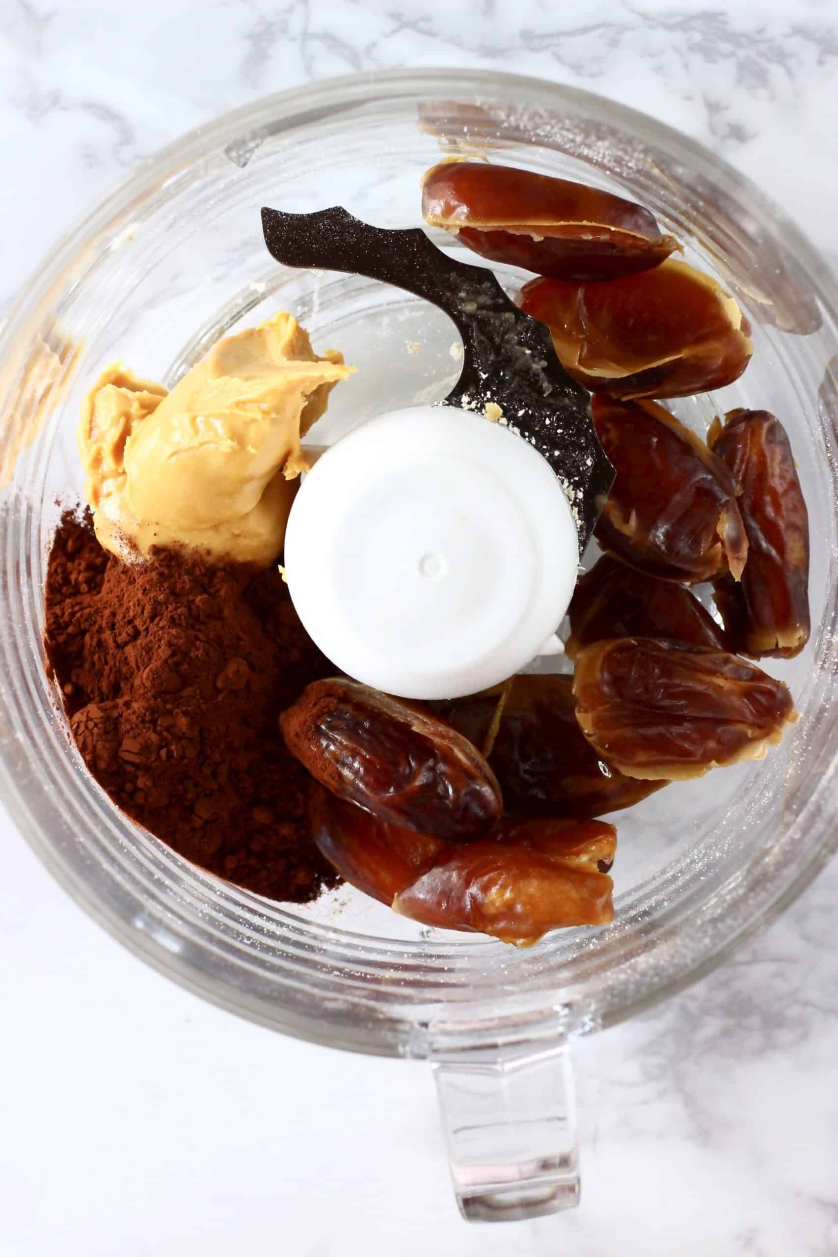 Dates, almond butter, salt and cocoa powder in a food processor
