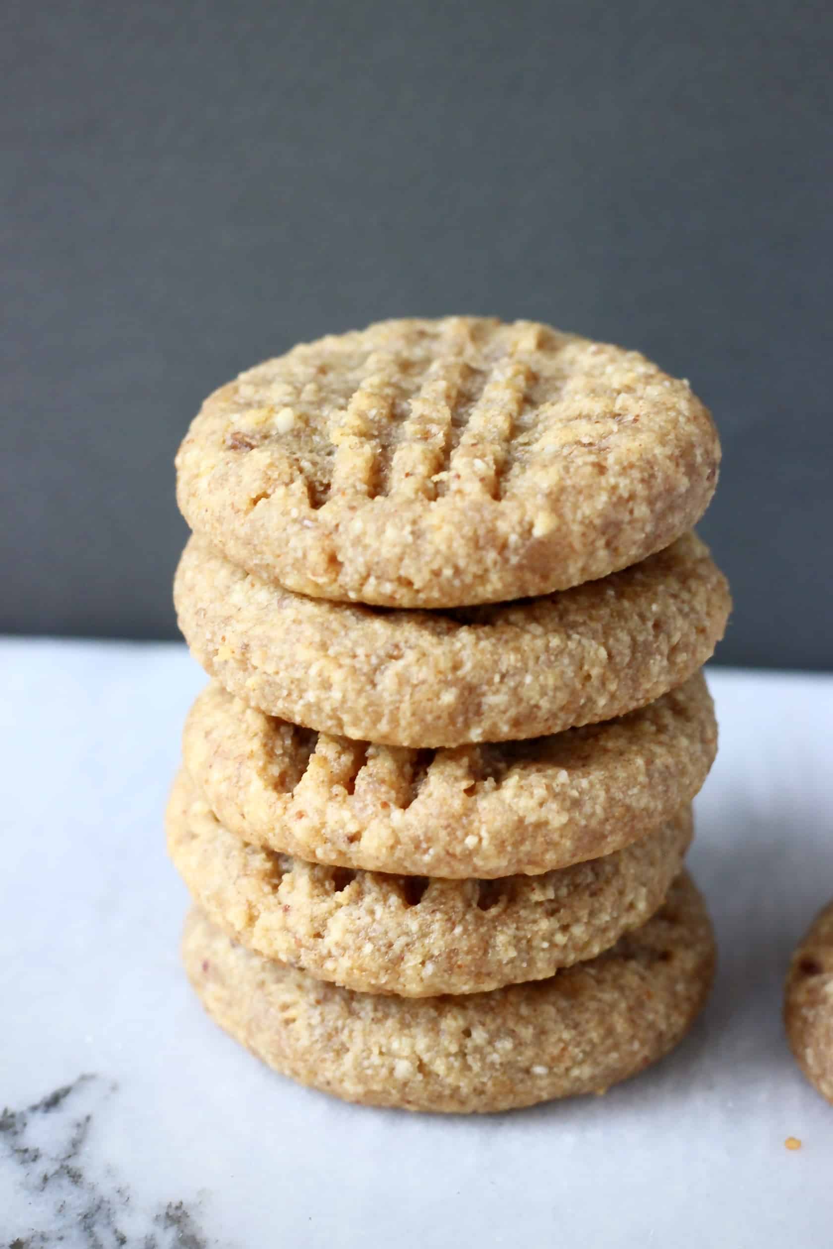 A stack of five gluten-free vegan peanut butter cookies