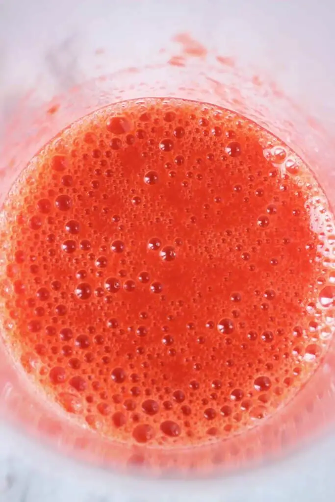 Photo of strawberry purée in a glass 