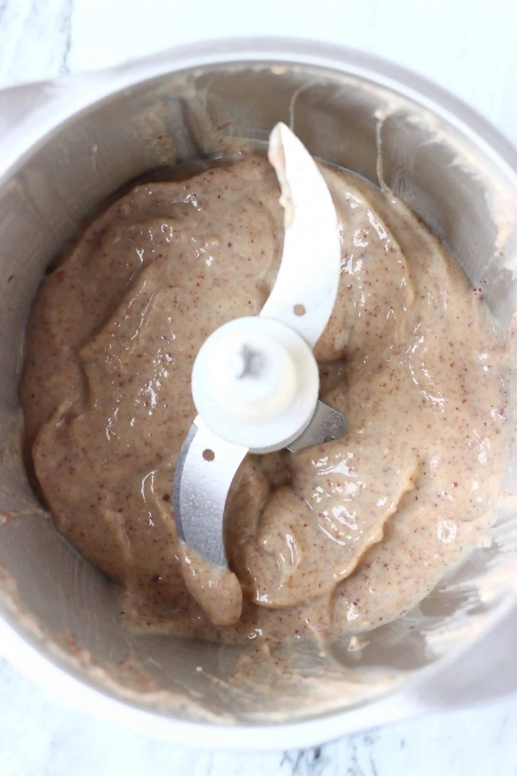 Blended dates and tofu in a food processor