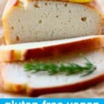 Photo of a sliced white pound cake taken from the side with two slices