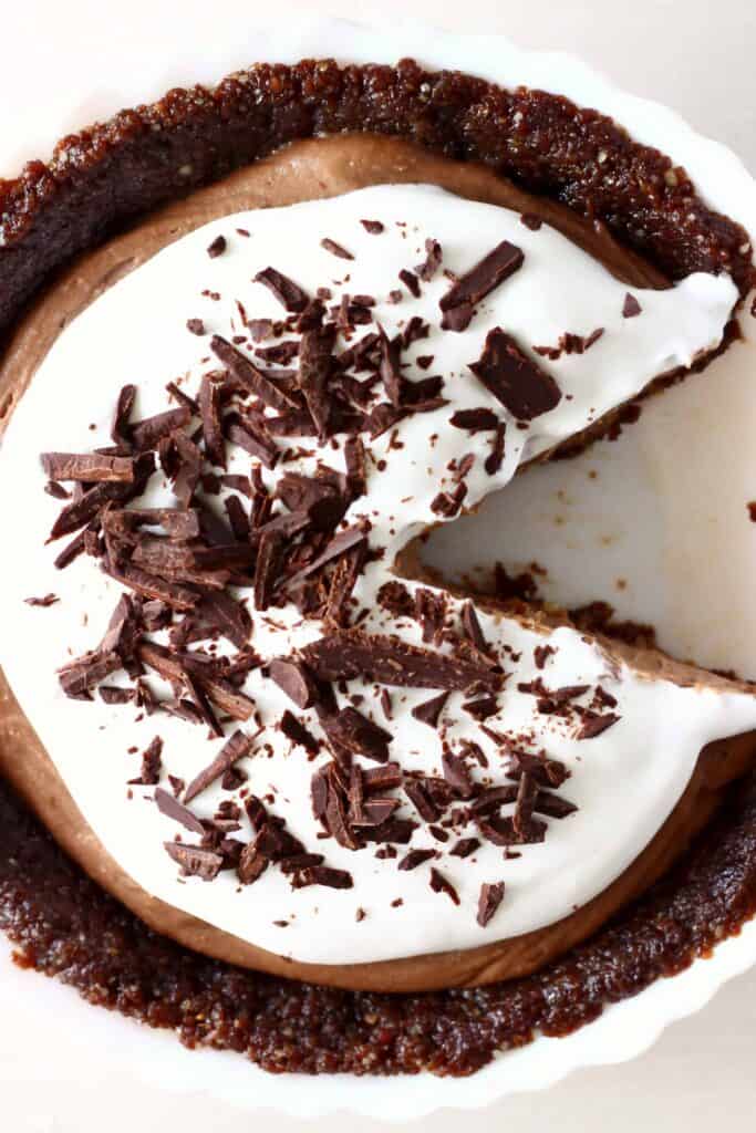 Photo of a chocolate pie taken from above with a slice cut out of it