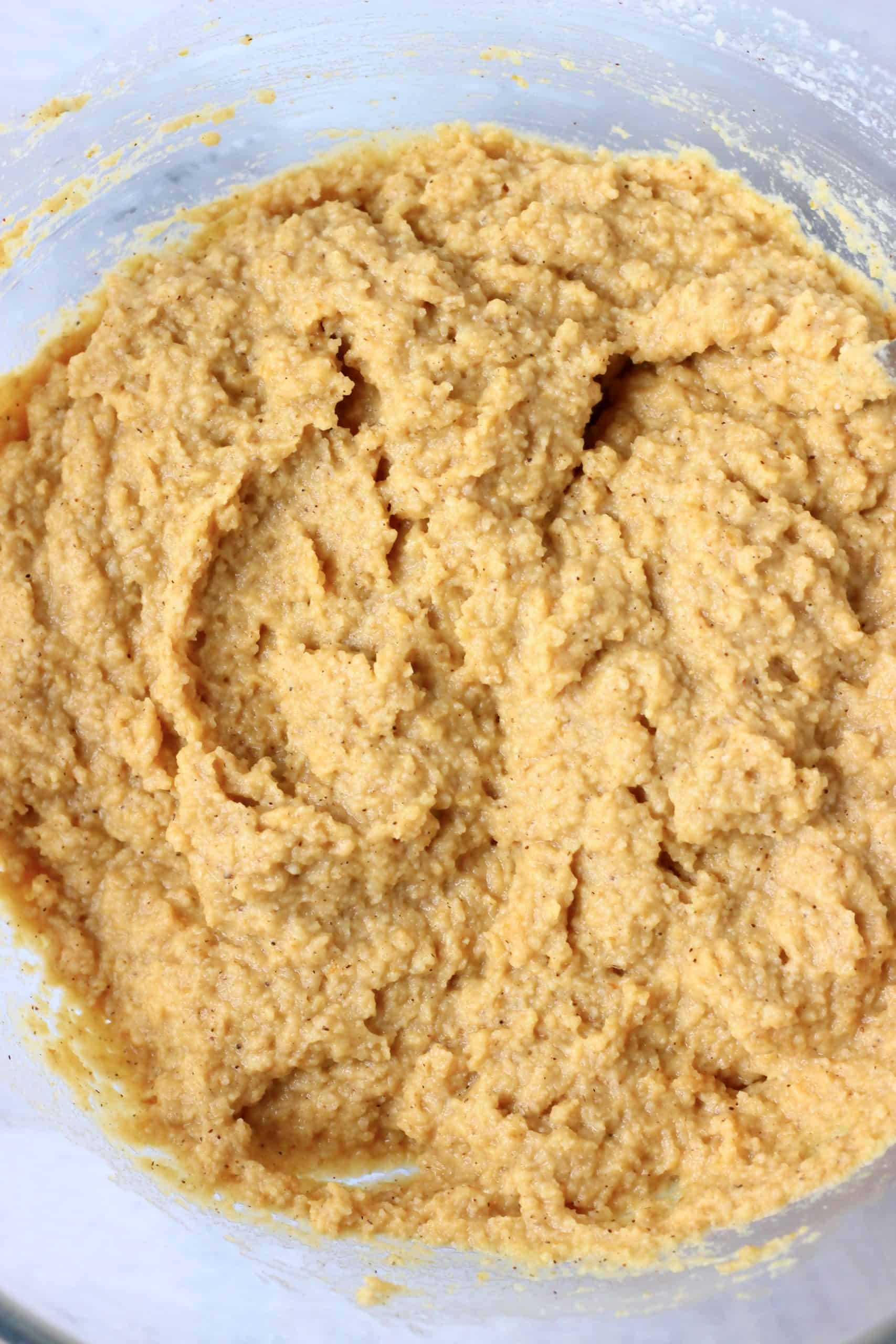 Gluten-free vegan pumpkin bread batter in a glass bowl