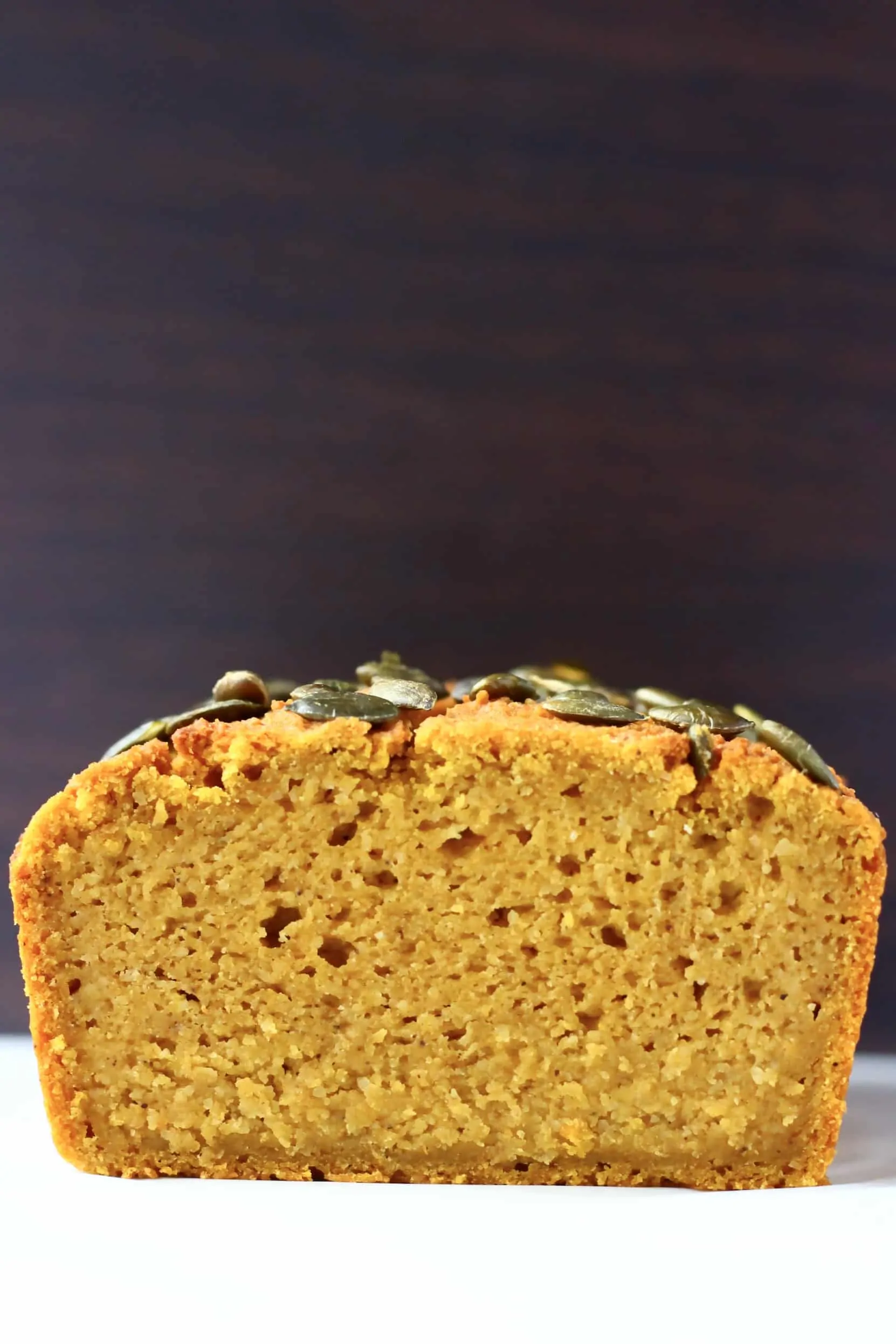 A sliced loaf of gluten-free vegan pumpkin bread