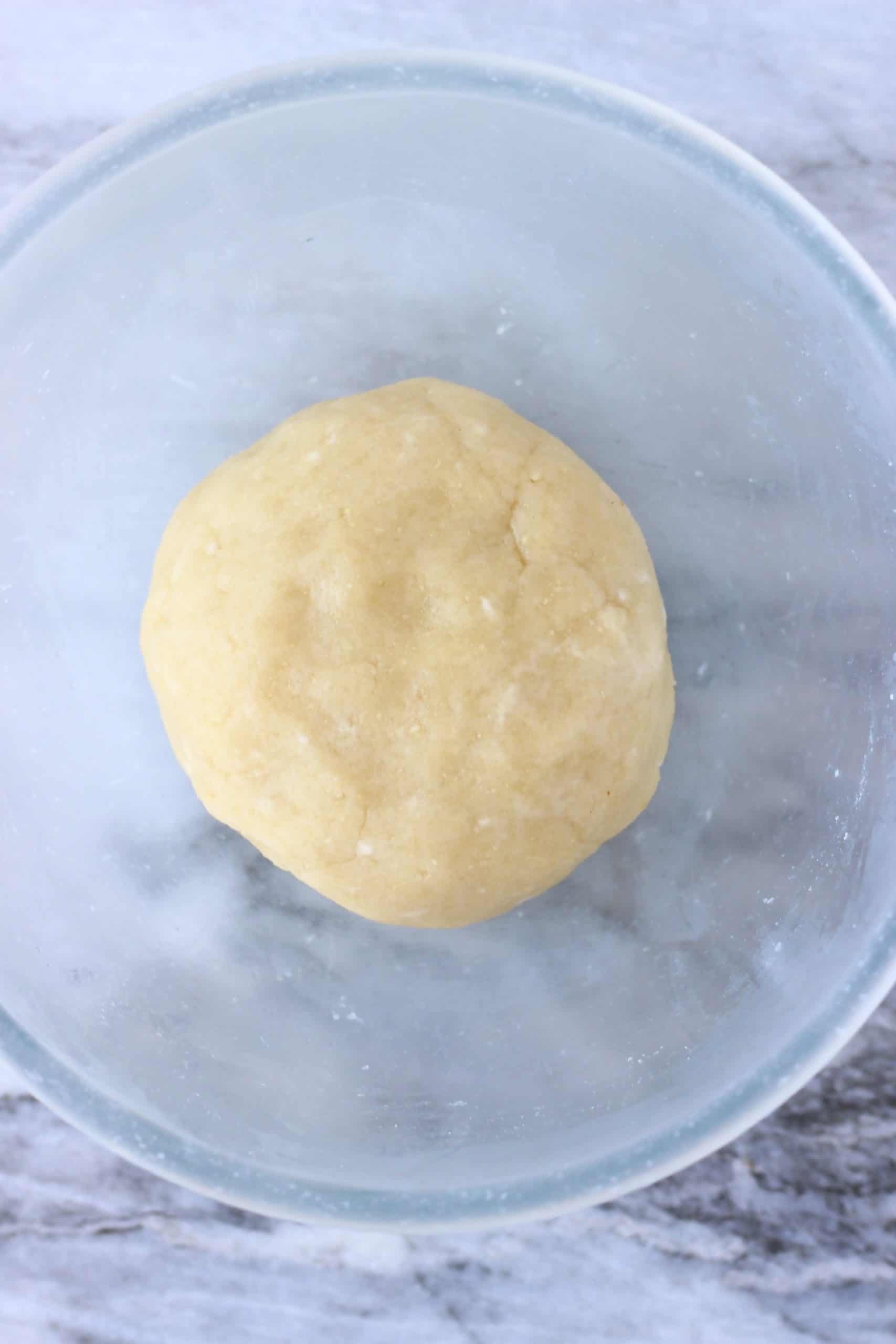 Raw gluten-free vegan pastry dough in a glass bowl