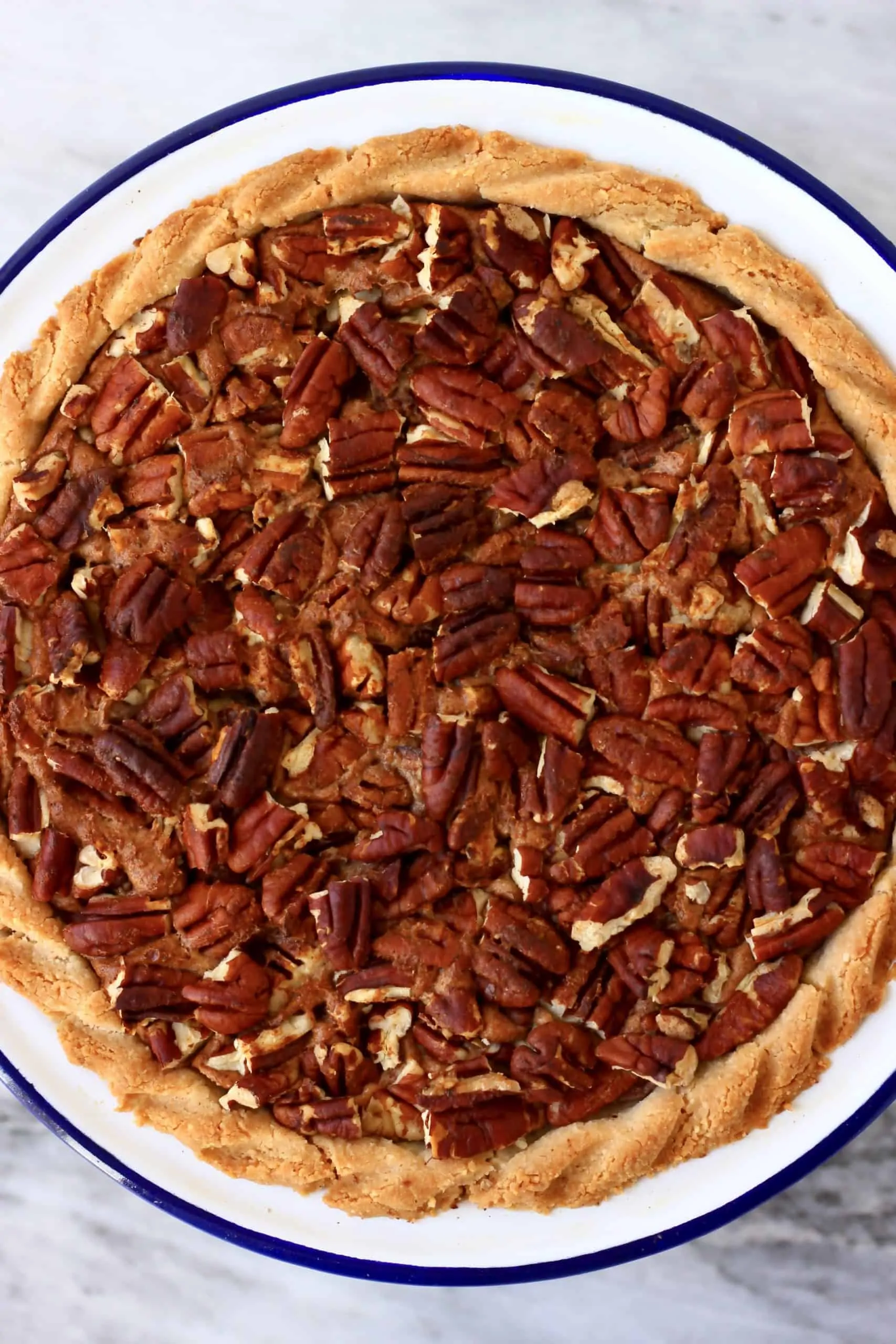 A gluten-free vegan pecan pie in a pie dish