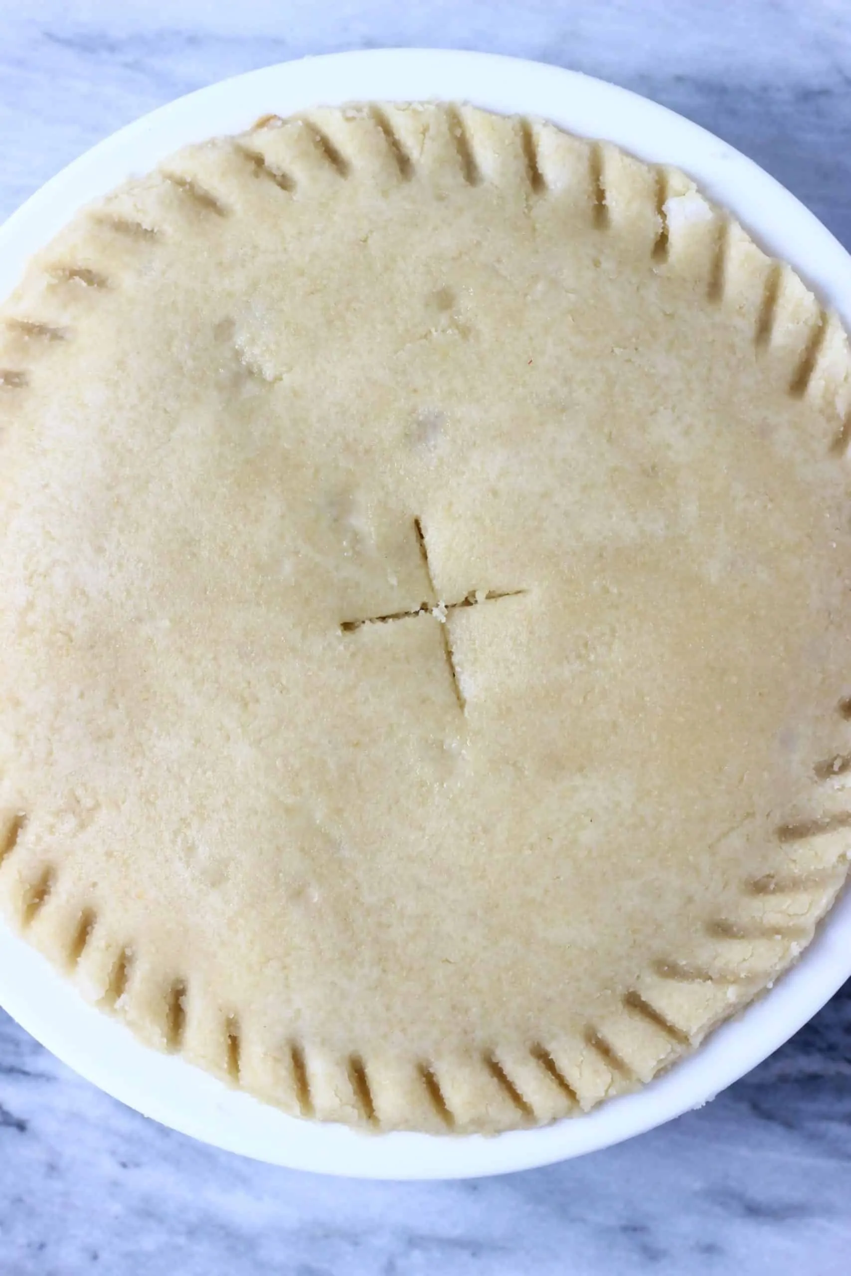 A raw gluten-free vegan apple pie in a pie dish