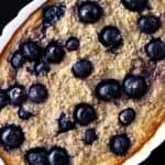 Vegan blueberry banana baked oatmeal in a white oval dish