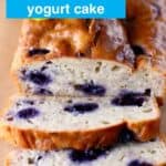 Photo of a blueberry loaf cake with two slices of it next to it