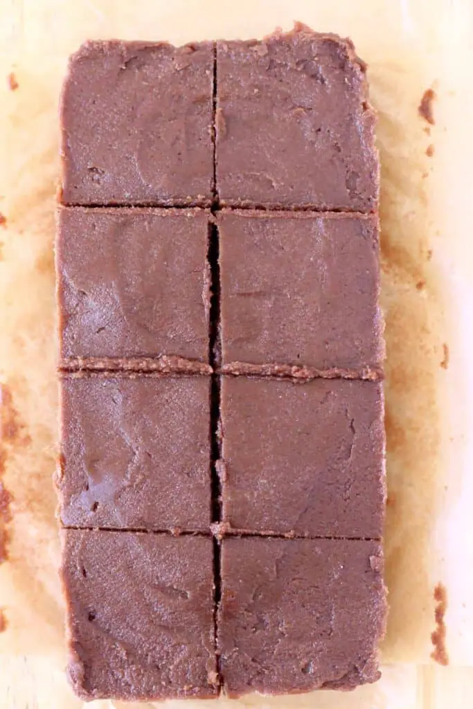 Photo of eight pieces of chocolate fudge on a piece of brown baking paper