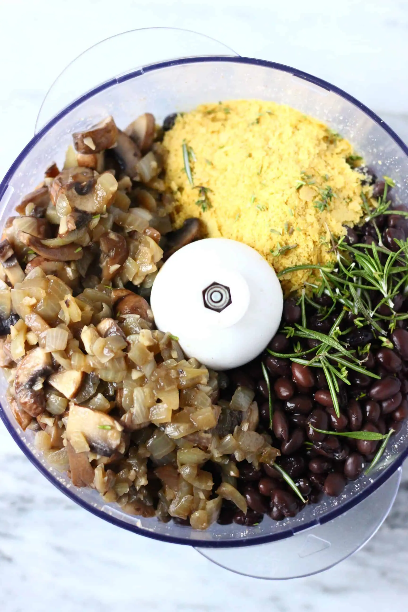 Fried onion and mushrooms, nutritional yeast, rosemary, black beans and nutritional yeast in a food processor 