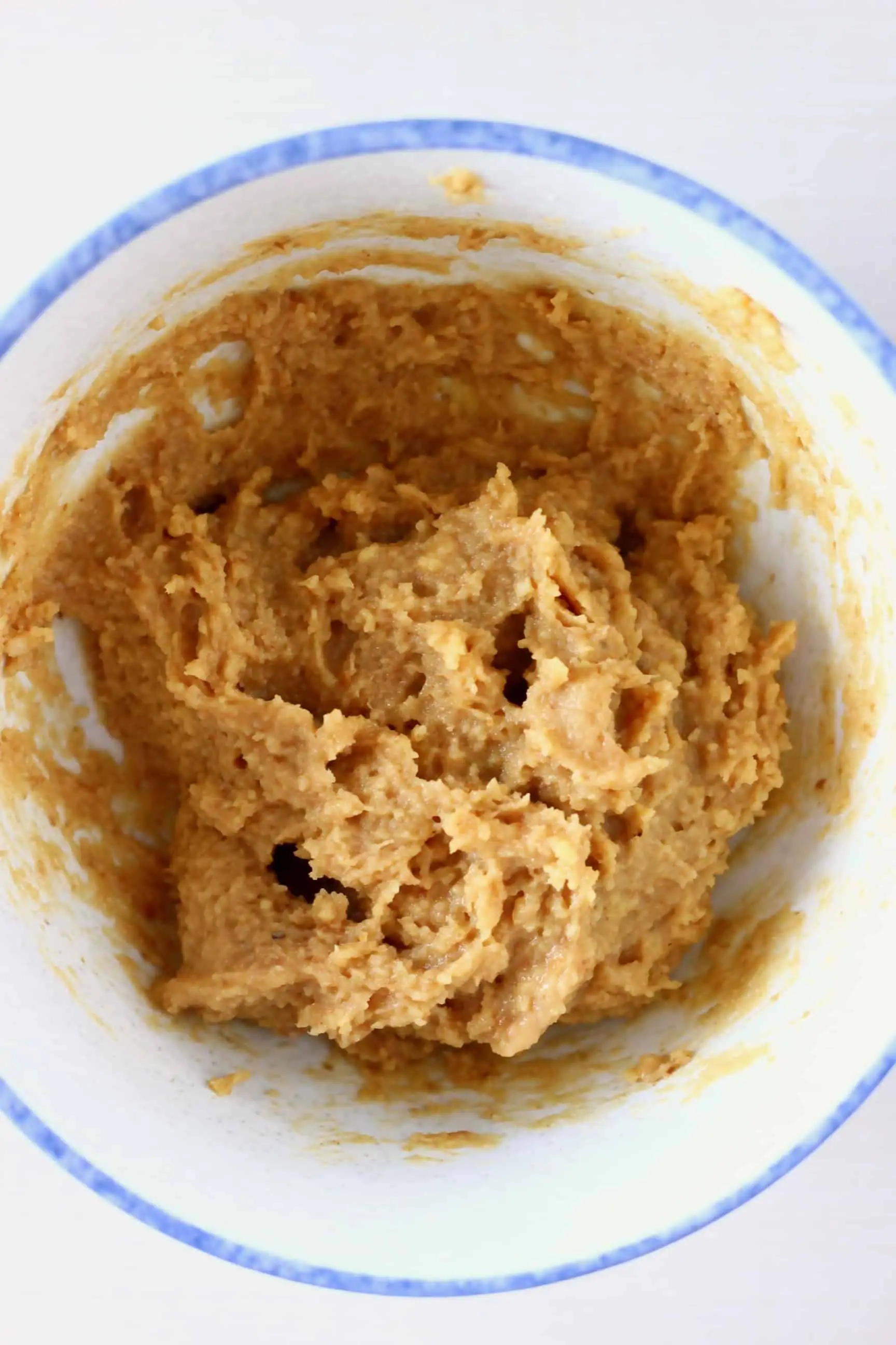 Raw almond butter cookie dough in a mixing bowl