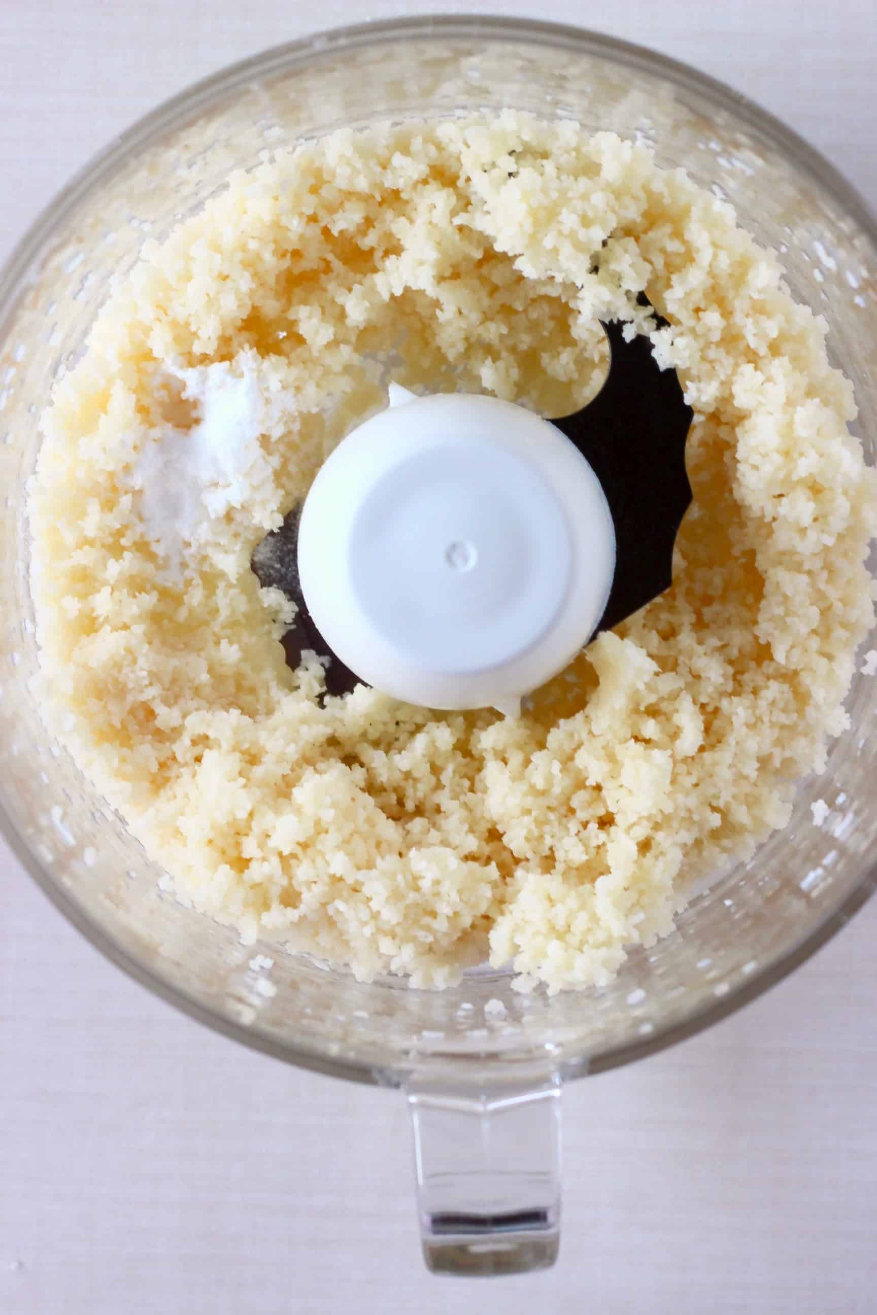 Shredded coconut and baking powder in a food processor