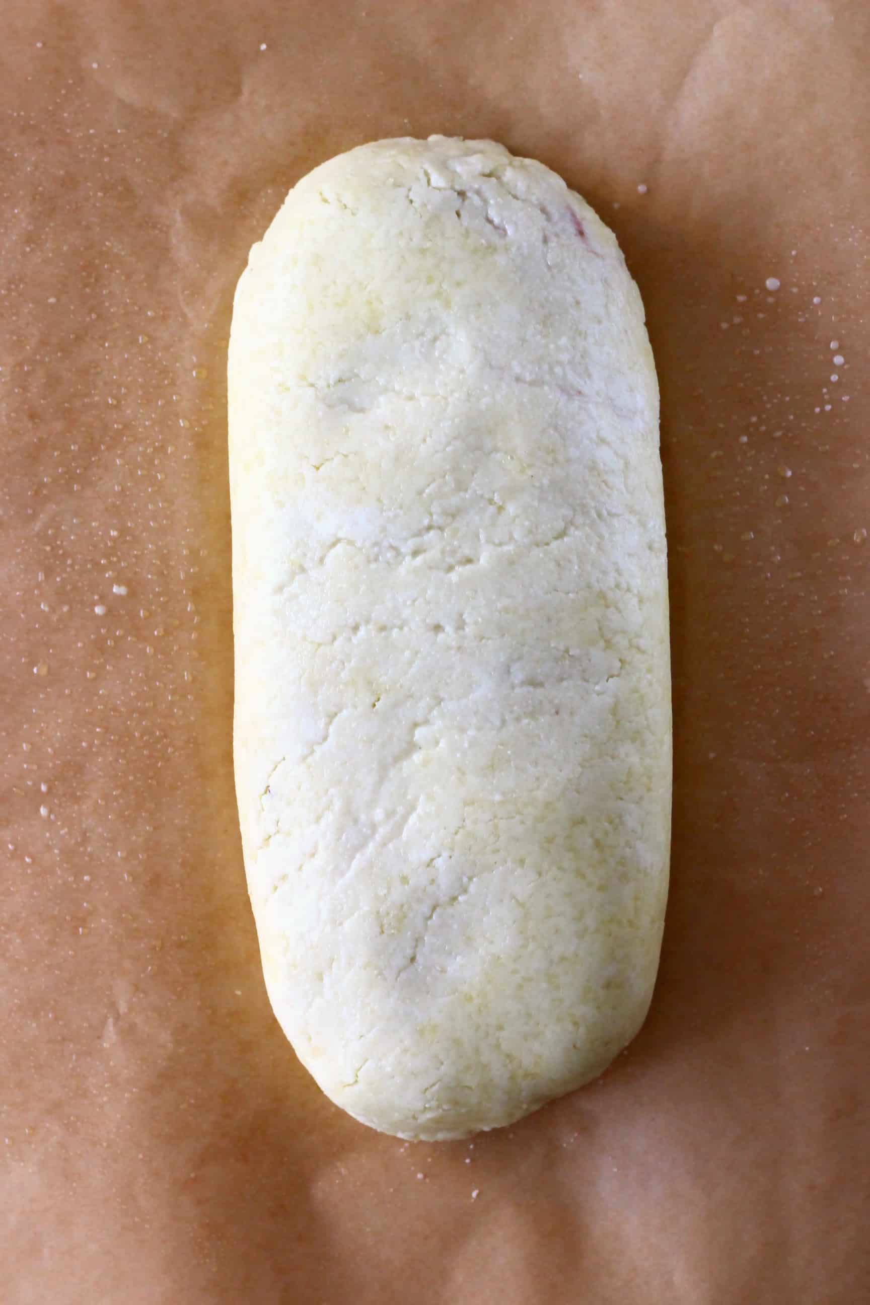 This Vegan Wellington is crispy and flaky, rich and hearty and so full of flavour! A seriously satisfying plant-based showstopper - it's perfect for Christmas, Thanksgiving, Easter and everything in between! Vegetarian, gluten-free, dairy-free, egg-free. #vegan #vegetarian #christmas #thanksgiving #dairyfree #glutenfree #rhiansrecipes A raw vegan wellington on a sheet of baking paper