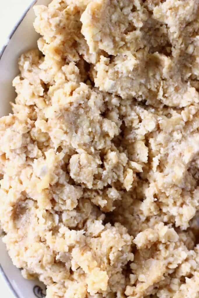 Peanut butter oatmeal cookie dough in a mixing bowl