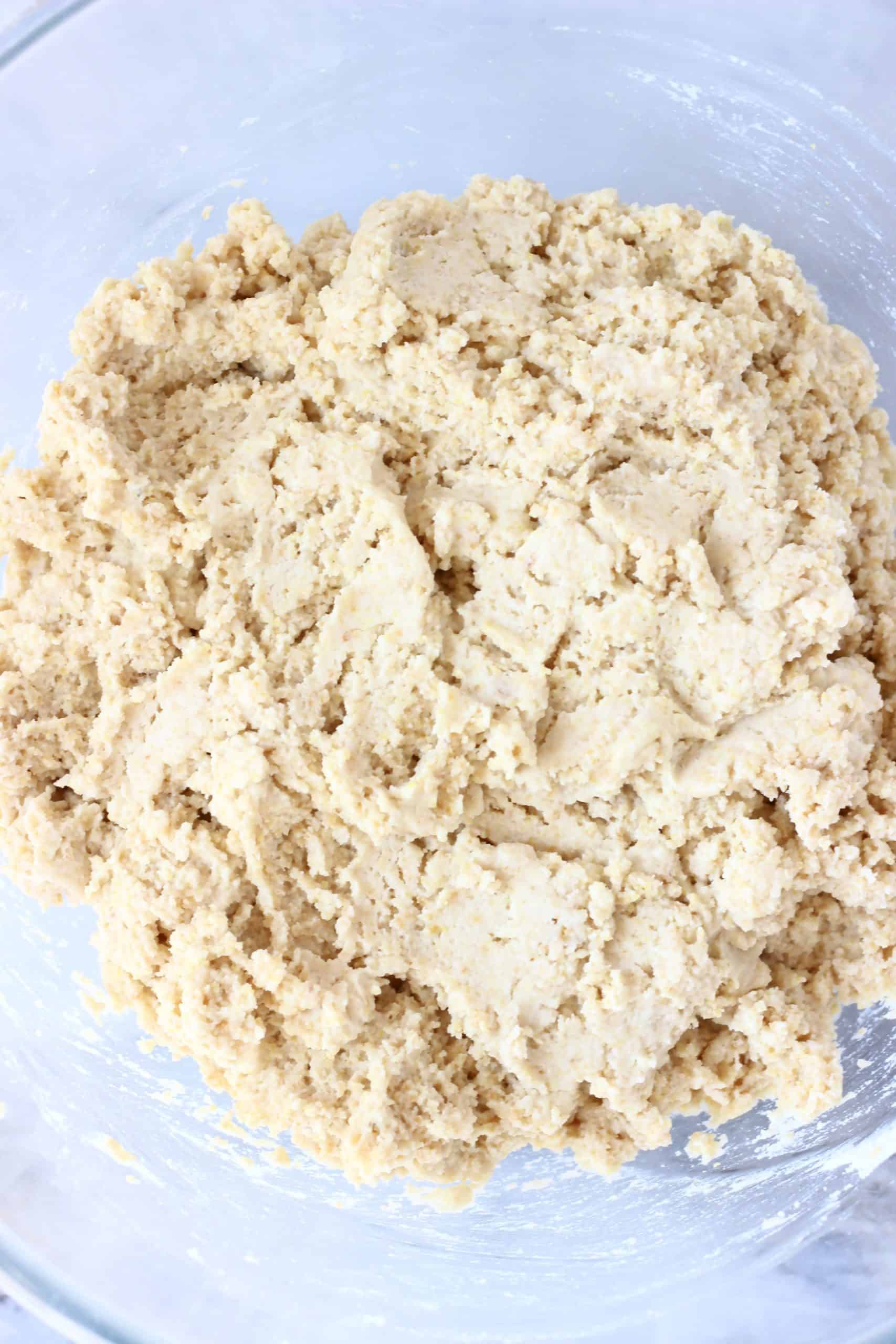 Raw gluten-free dinner rolls dough in a bowl