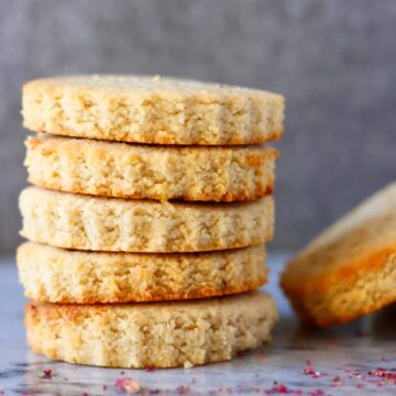 Five circular vegan shortbread cookies stacked up on each other