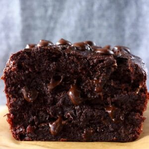 A loaf of sliced gluten-free vegan chocolate banana bread with chocolate chips