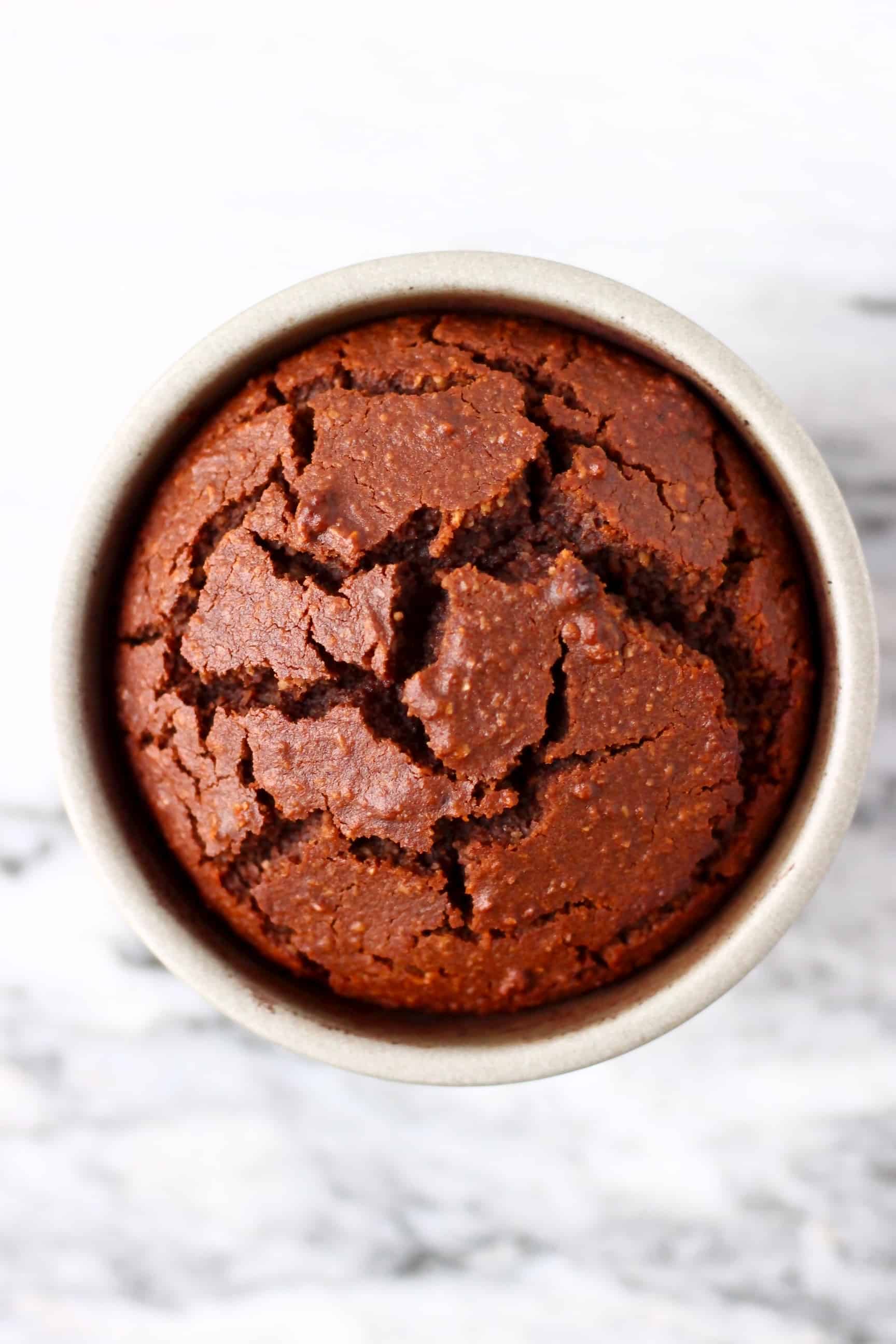 A small silver pudding tin filled with gluten-free vegan chocolate lava cake