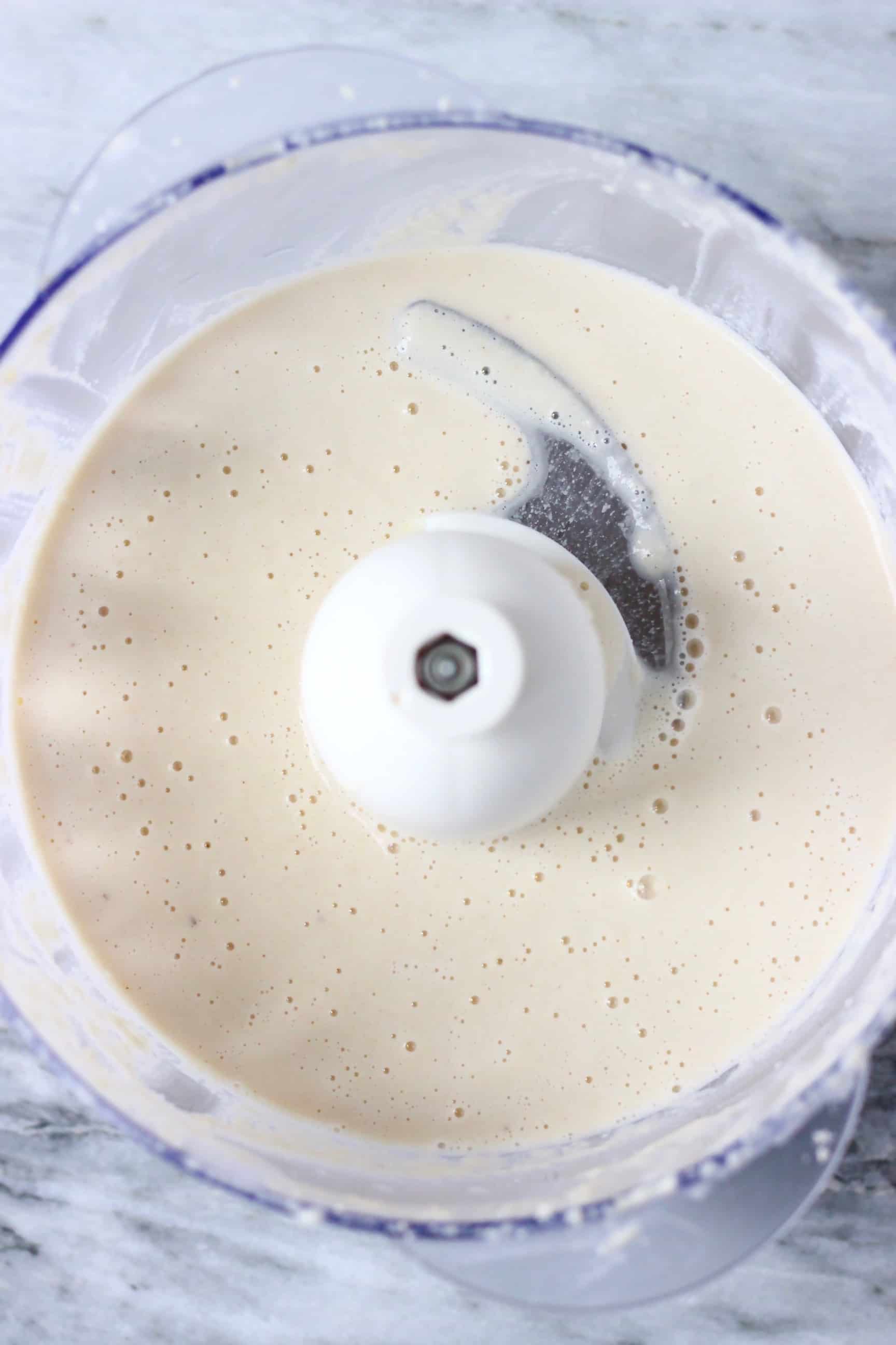 Blended cashew nut cream in a food processor 