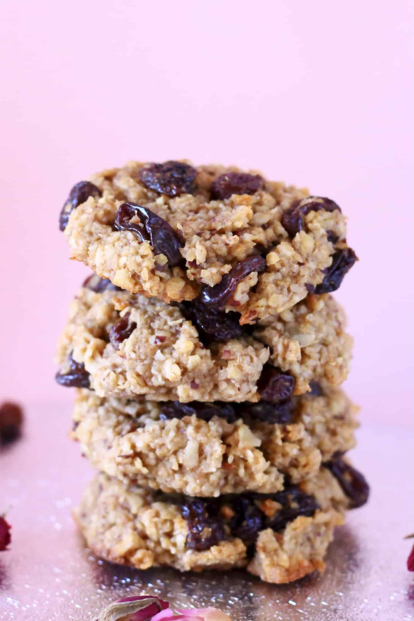 A stack of four gluten-free vegan oatmeal raisin cookies