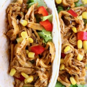 Shredded mushroom tacos with sweetcorn and red pepper on a blue plate