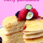 A stack of gluten-free vegan pancakes topped with berries