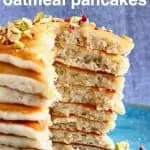 A stack of sliced oatmeal pancakes on a blue plate against a grey background
