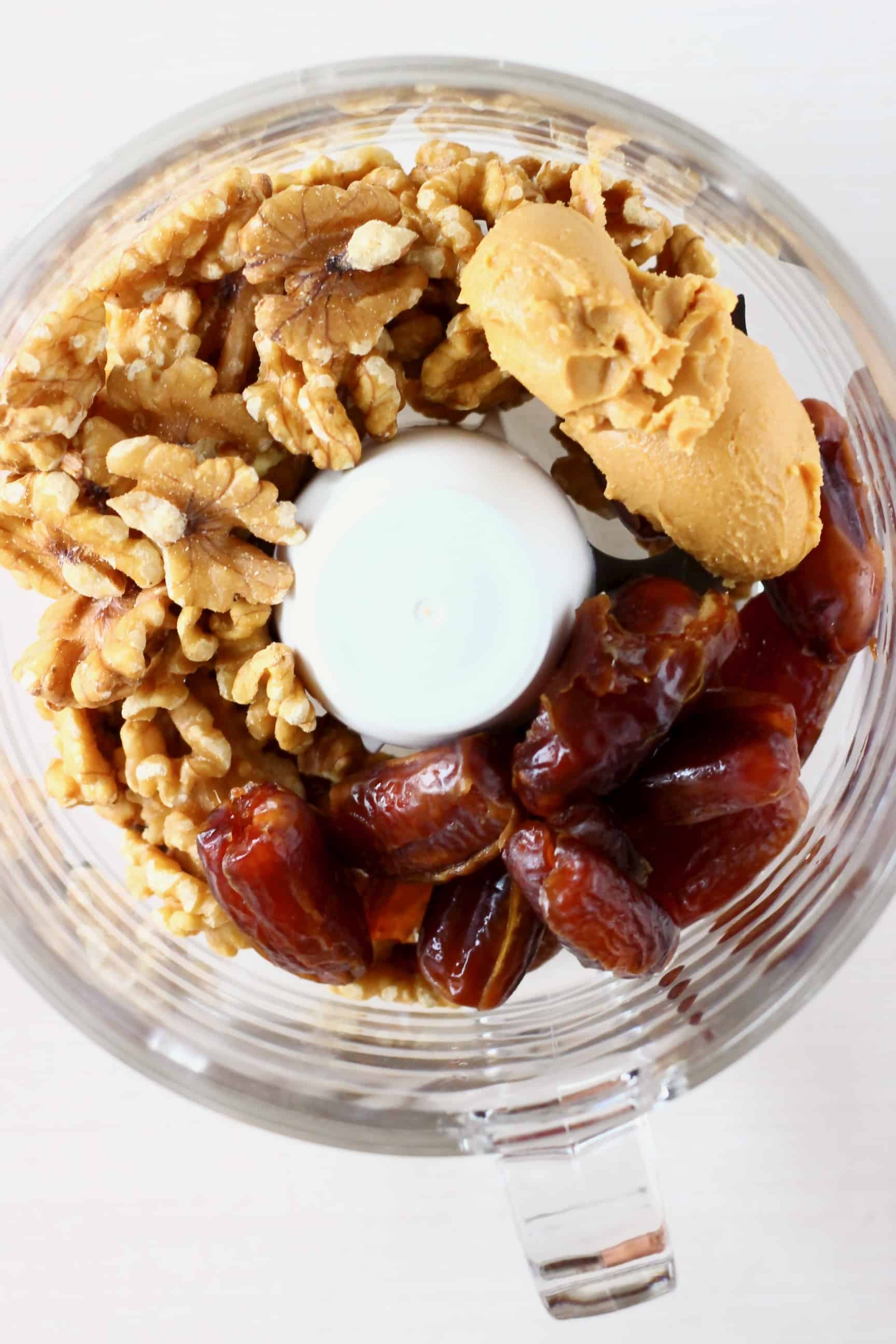Walnuts, dates and peanut butter in a food processor