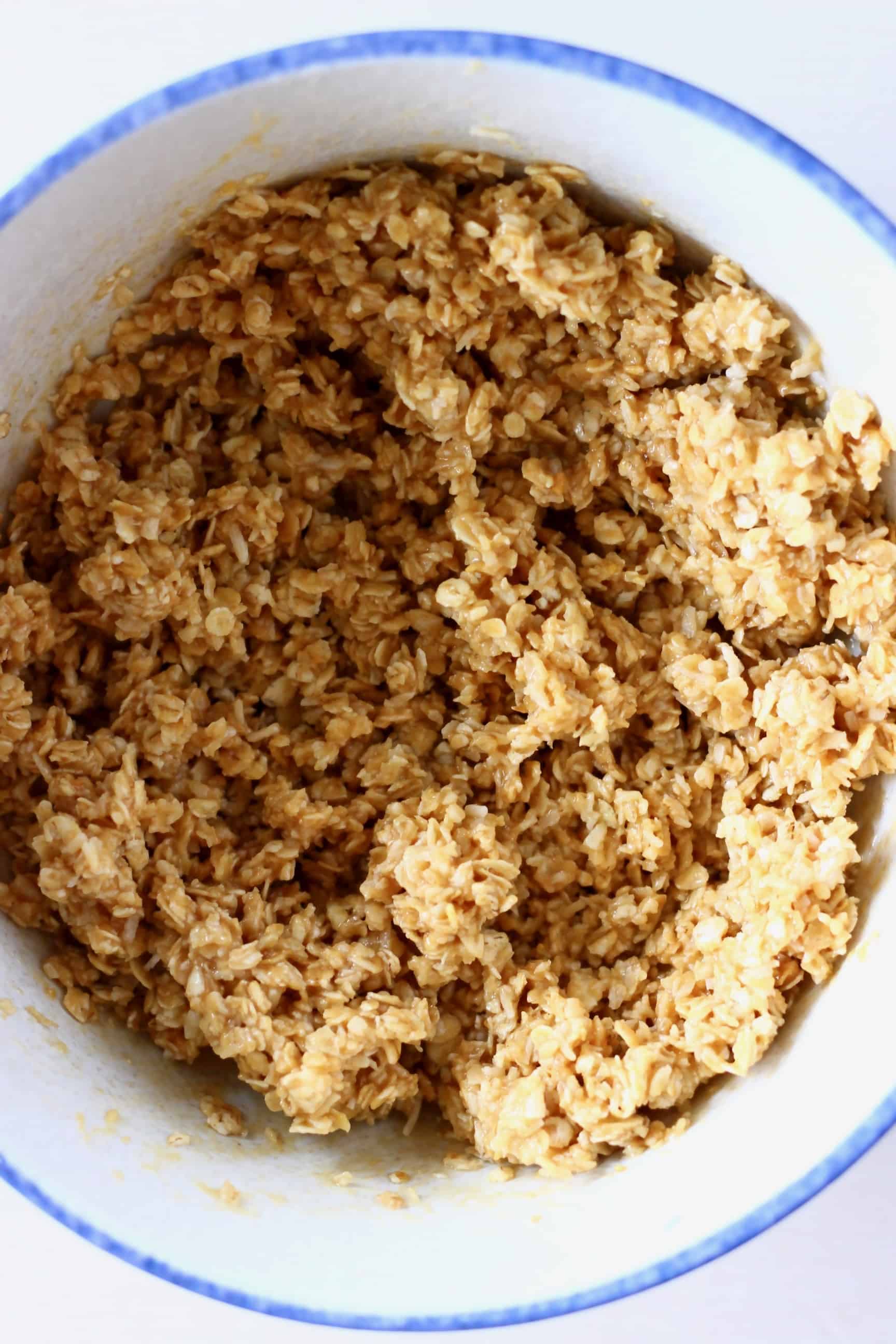 No-bake energy bites mixture with oats, peanut butter and agave syrup in a bowl