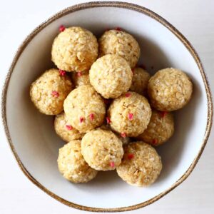A pile of no-bake energy bites in a bowl
