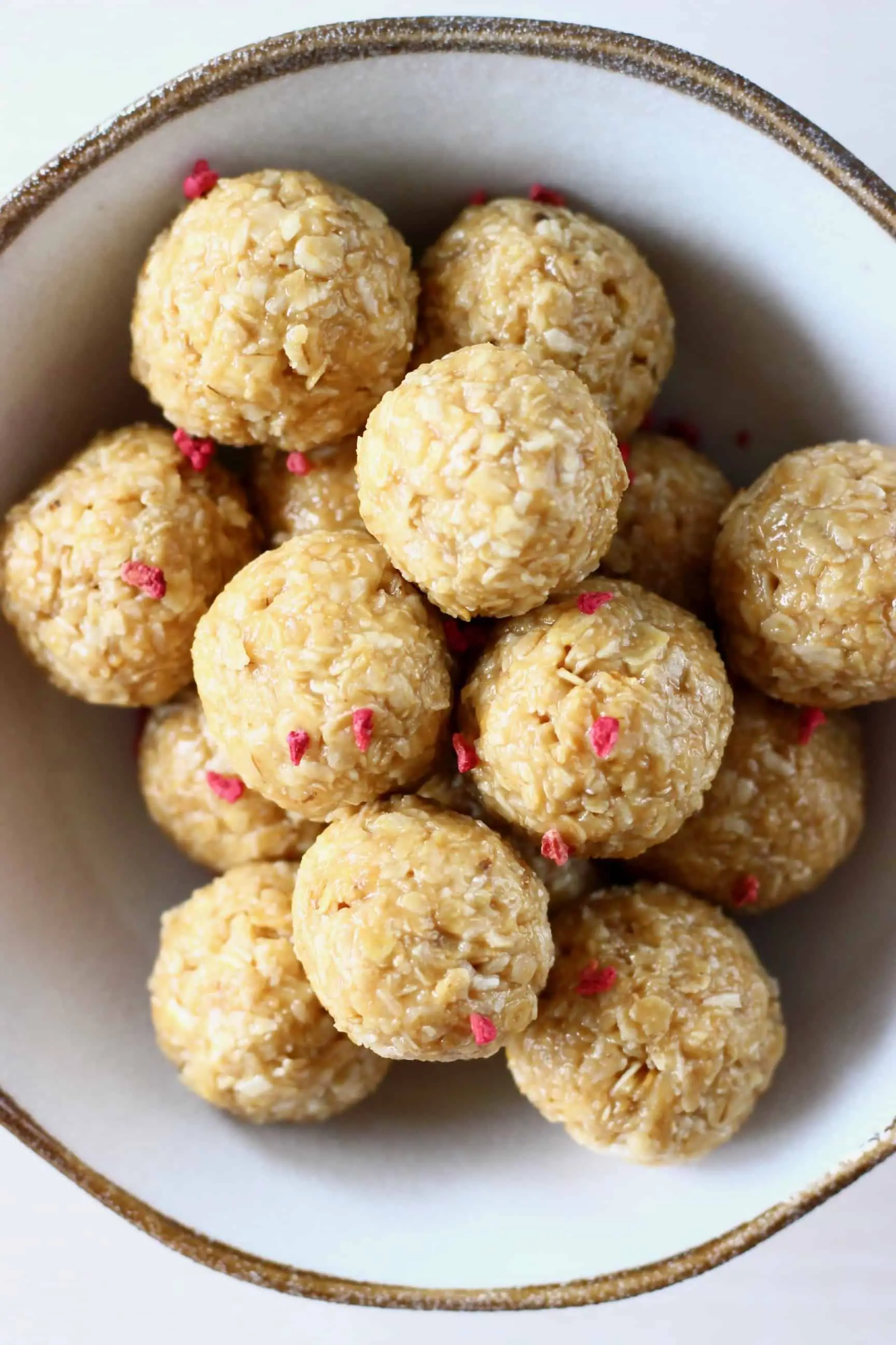 A pile of no-bake energy bites in a bowl