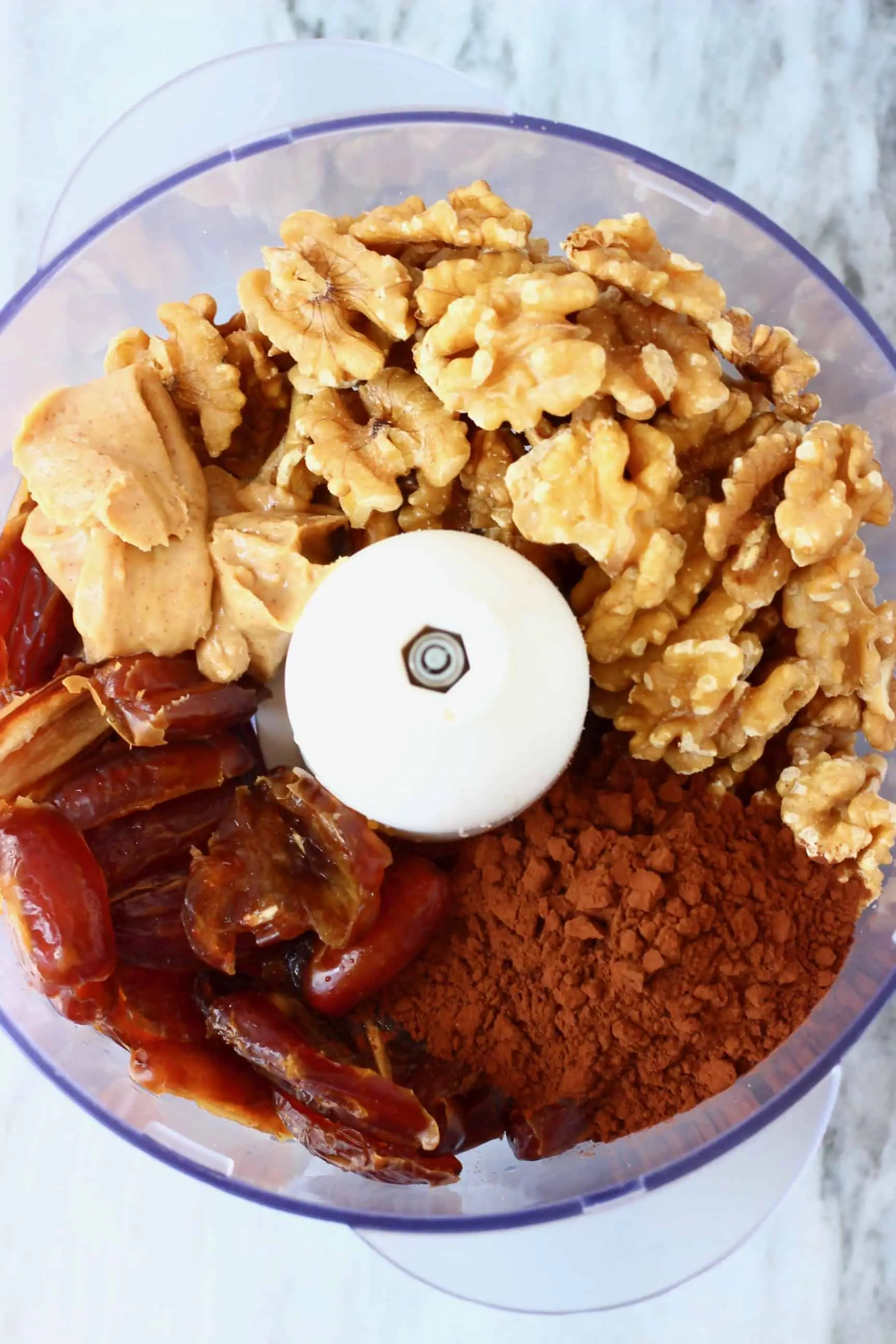 Dates, peanut butter, walnuts and cocoa powder in a food processor 