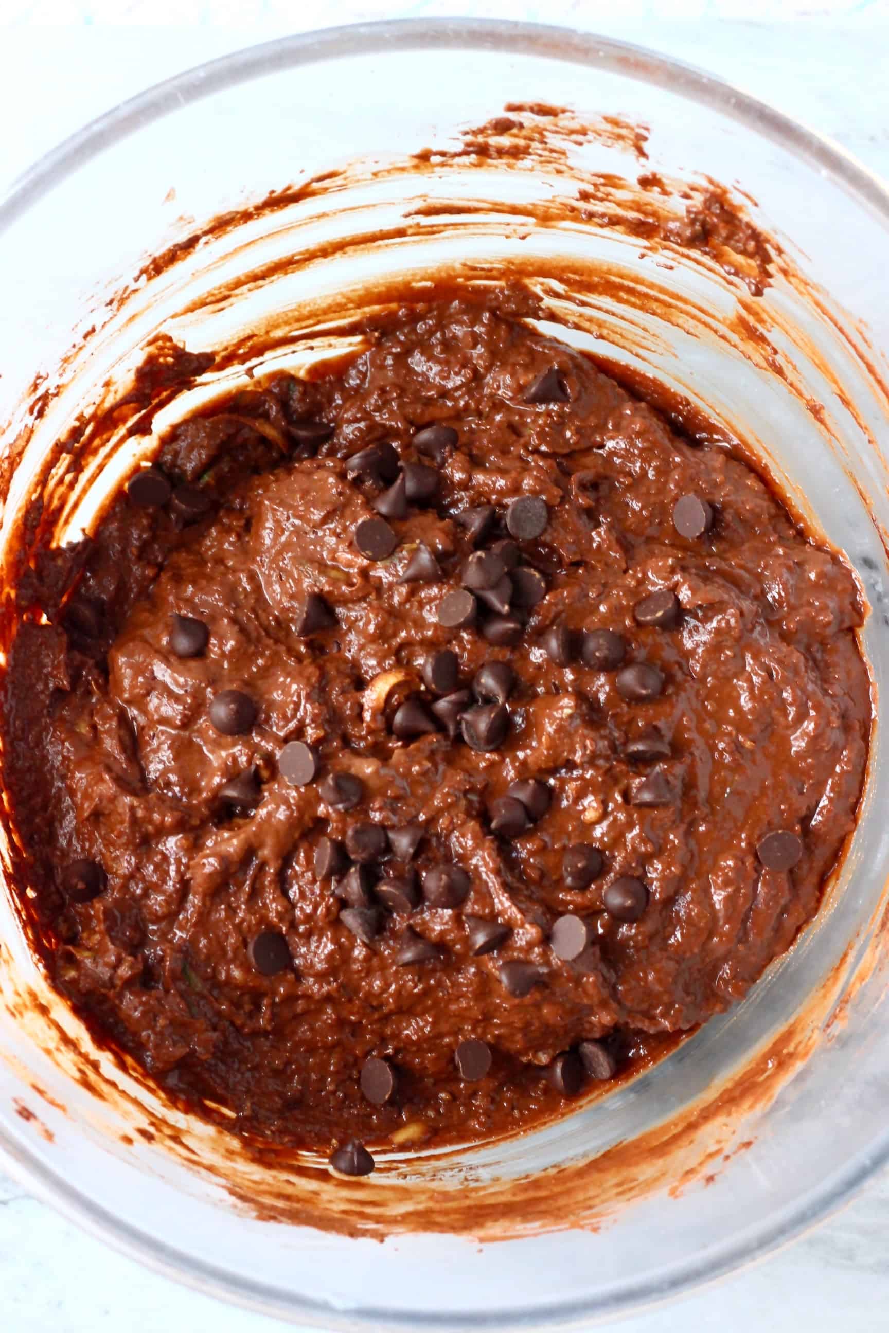 Raw gluten-free vegan chocolate zucchini bread batter with chocolate chips in a bowl