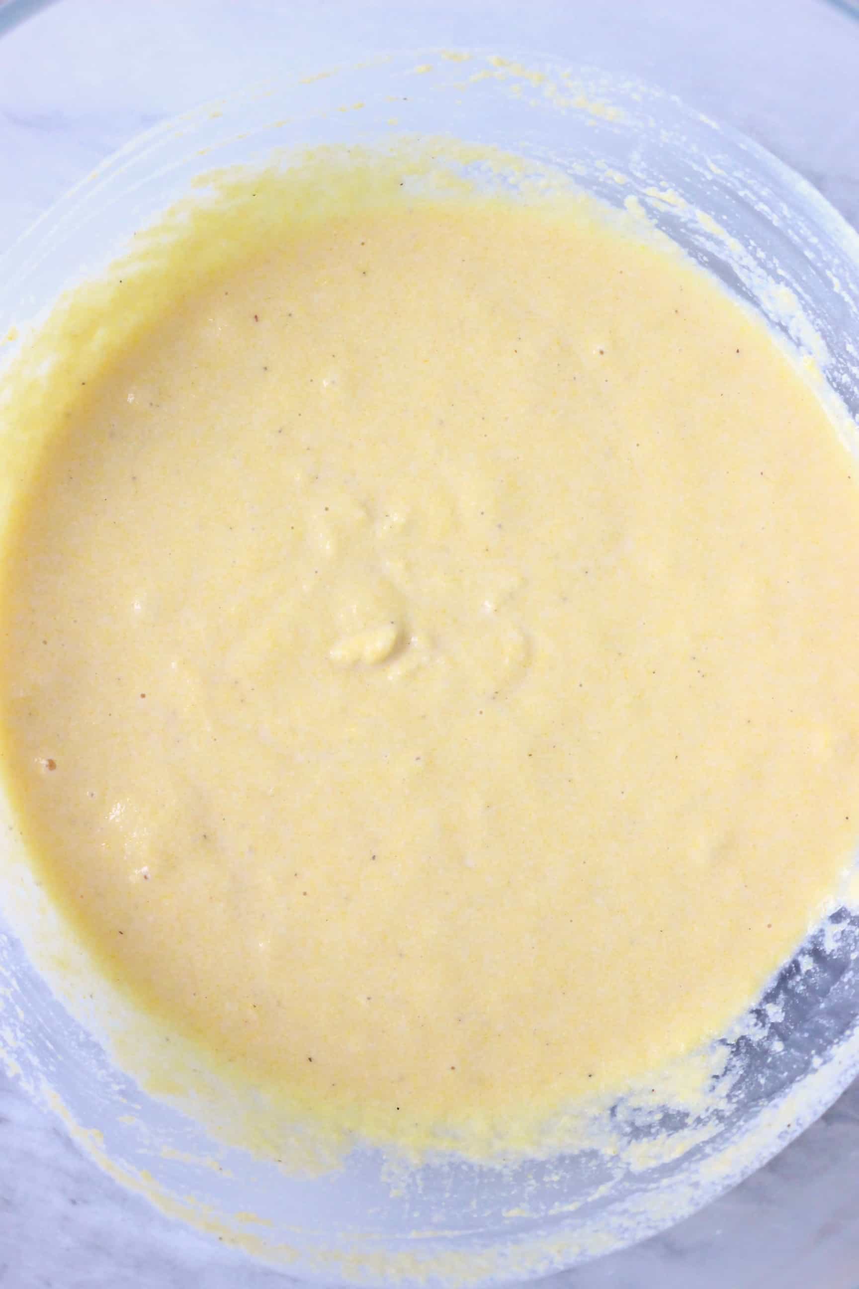 Raw gluten-free vegan cornmeal pancake batter in a bowl 