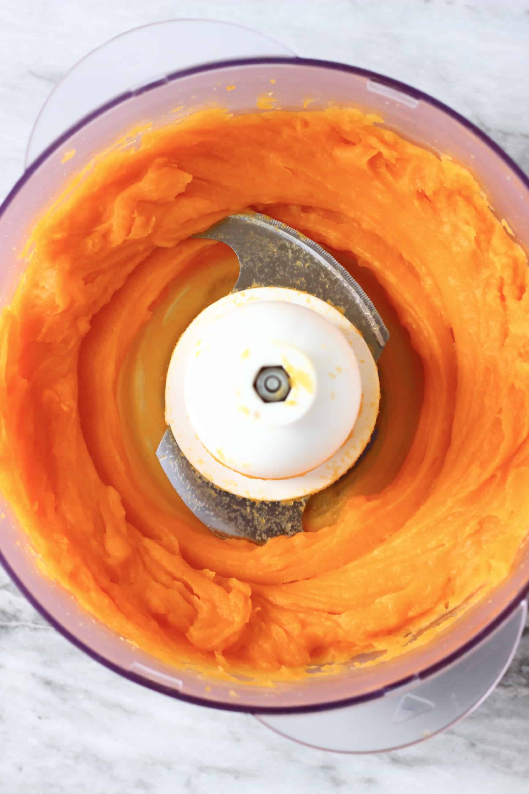 Orange sweet potato purée in a food processor